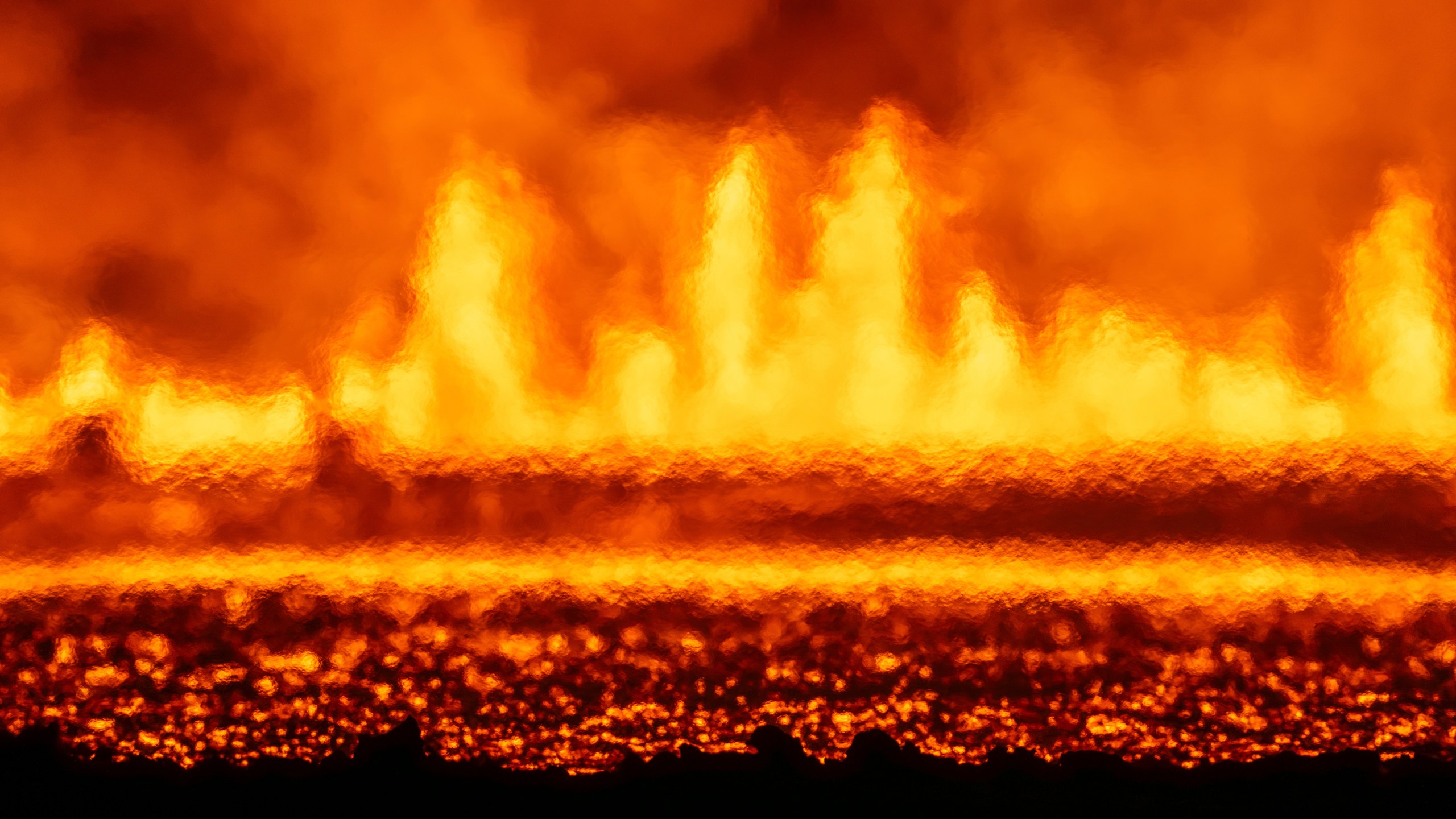 A new volcanic eruption that started on the Reykjanes Peninsula as seen from Grindavikurvegur, the road to Grindavik in Iceland, Wednesday, Nov.20, 2024. (AP Photo/Marco di Marco)