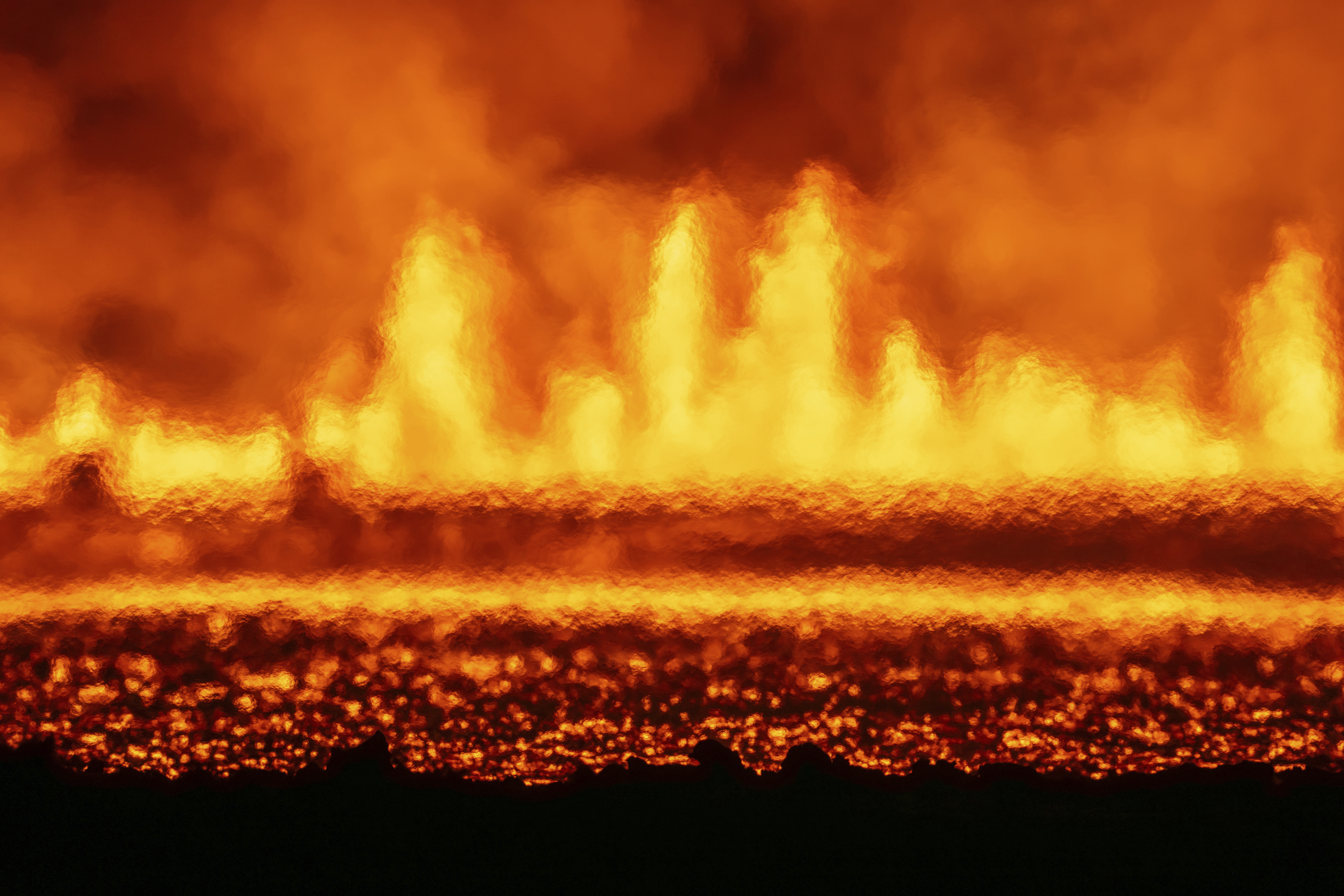 A new volcanic eruption that started on the Reykjanes Peninsula as seen from Grindavikurvegur, the road to Grindavik in Iceland, Wednesday, Nov.20, 2024. (AP Photo/Marco di Marco)