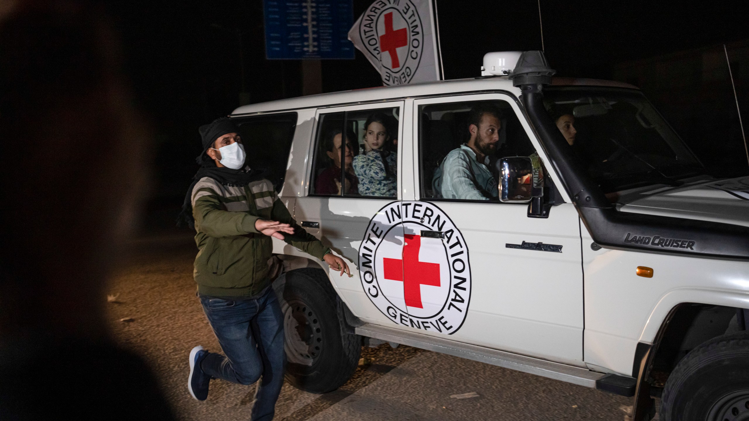 FILE - A Red Cross vehicle carrying Israeli hostages drives by at the Gaza Strip crossing into Egypt in Rafah on Nov. 25, 2023. (AP Photo/Fatima Shbair, File)