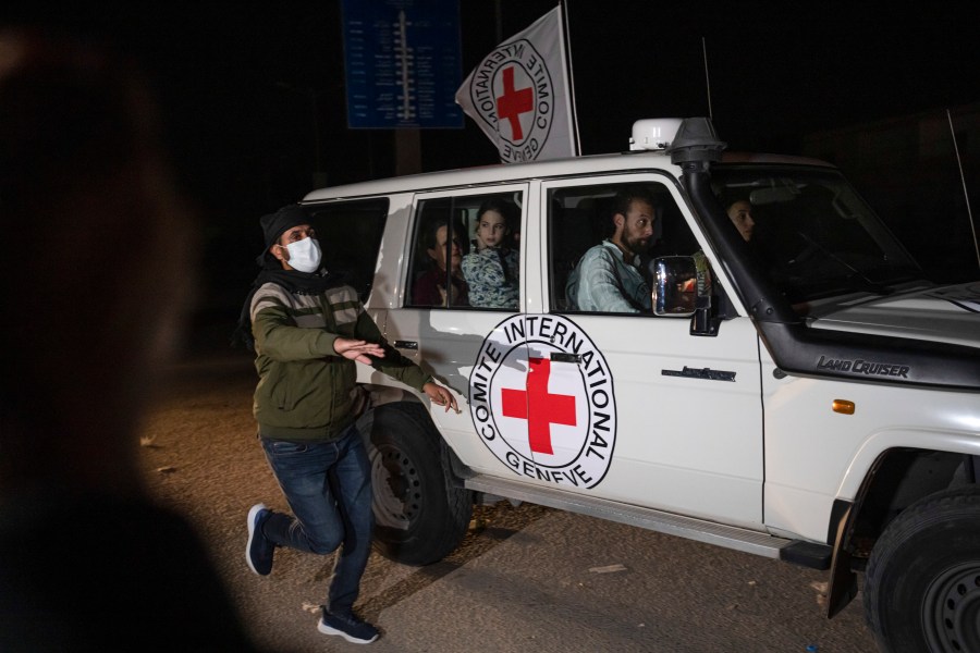 FILE - A Red Cross vehicle carrying Israeli hostages drives by at the Gaza Strip crossing into Egypt in Rafah on Nov. 25, 2023. (AP Photo/Fatima Shbair, File)