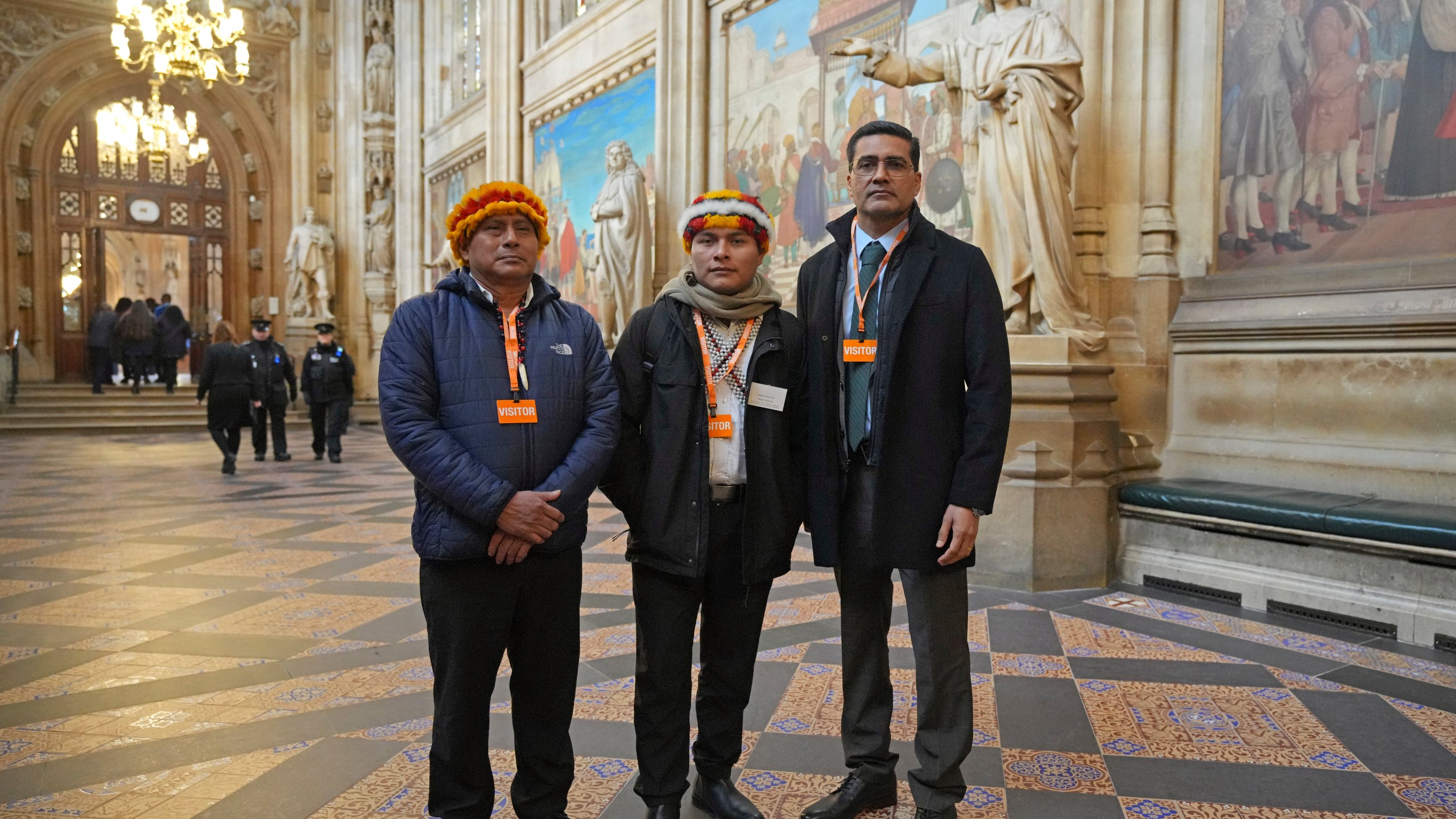 Indigenous leaders from the Wampis Nation in Peru, from left, Pamuk Teofilo Kukush Pati, Tsanim Evaristo Wajai Asamat and Jesus Javier Thomas Gonzalez, from Mexico, pose in St. Stephen's Hall in London, Thursday, Nov. 21, 2024. (AP Photo/Kin Cheung)