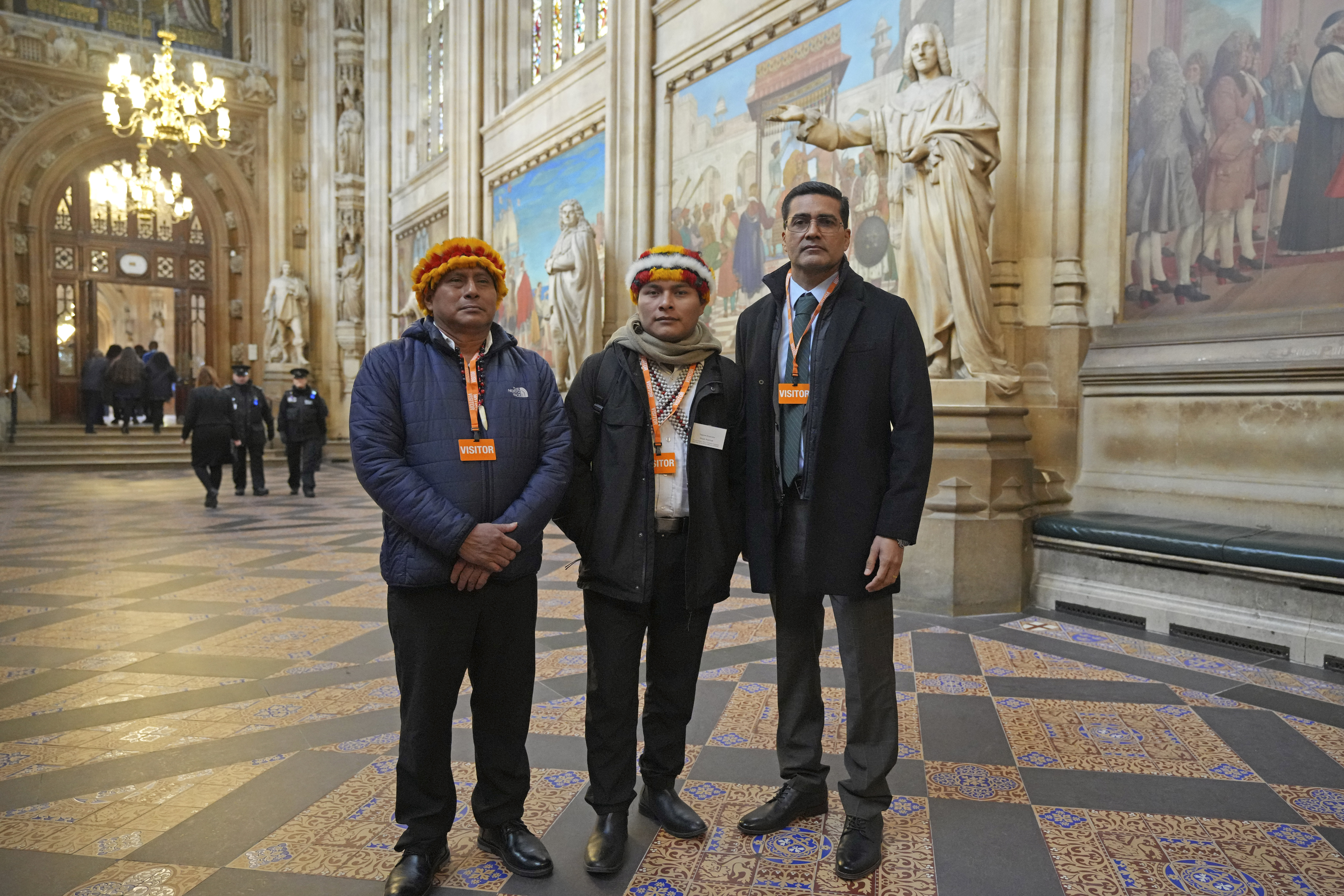 Indigenous leaders from the Wampis Nation in Peru, from left, Pamuk Teofilo Kukush Pati, Tsanim Evaristo Wajai Asamat and Jesus Javier Thomas Gonzalez, from Mexico, pose in St. Stephen's Hall in London, Thursday, Nov. 21, 2024. (AP Photo/Kin Cheung)