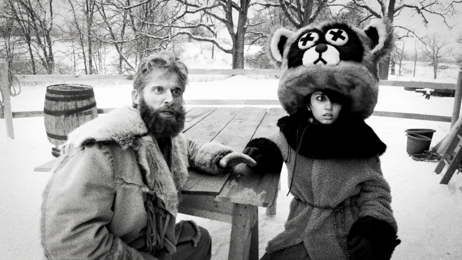 This image released by SRH shows Ryland Brickson Cole Tews, left, and Olivia Graves in a scene from the film "Hundreds of Beavers." (SRH via AP)