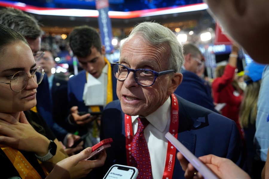 FILE - Ohio Gov. Mike DeWine talks to reporters during the Republican National Convention July 15, 2024, in Milwaukee. (AP Photo/Paul Sancya, File)