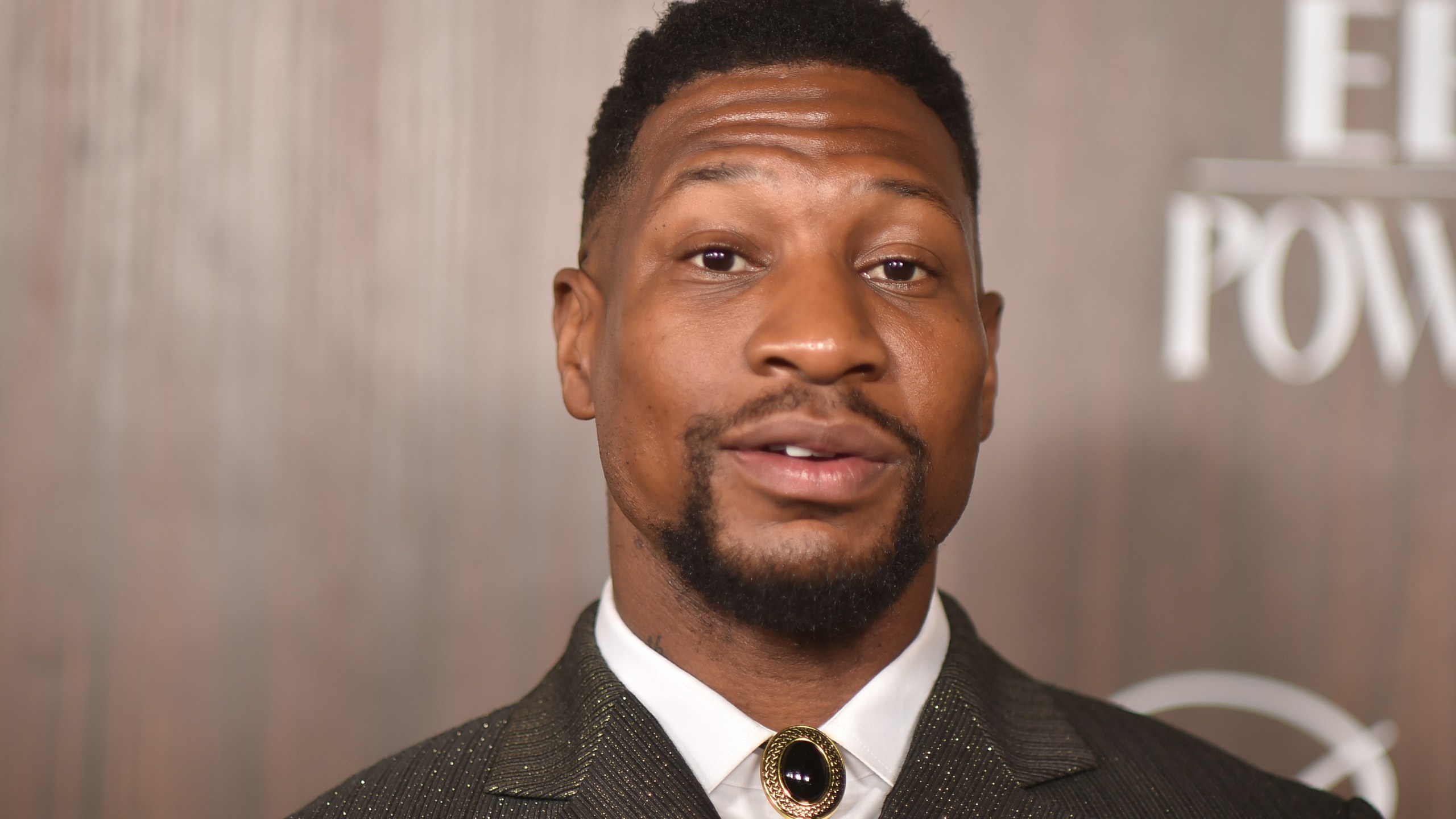 Jonathan Majors arrives at EBONY Power 100 on Sunday, Nov. 17, 2024, at nya studios WEST in Los Angeles. (Photo by Richard Shotwell/Invision/AP)