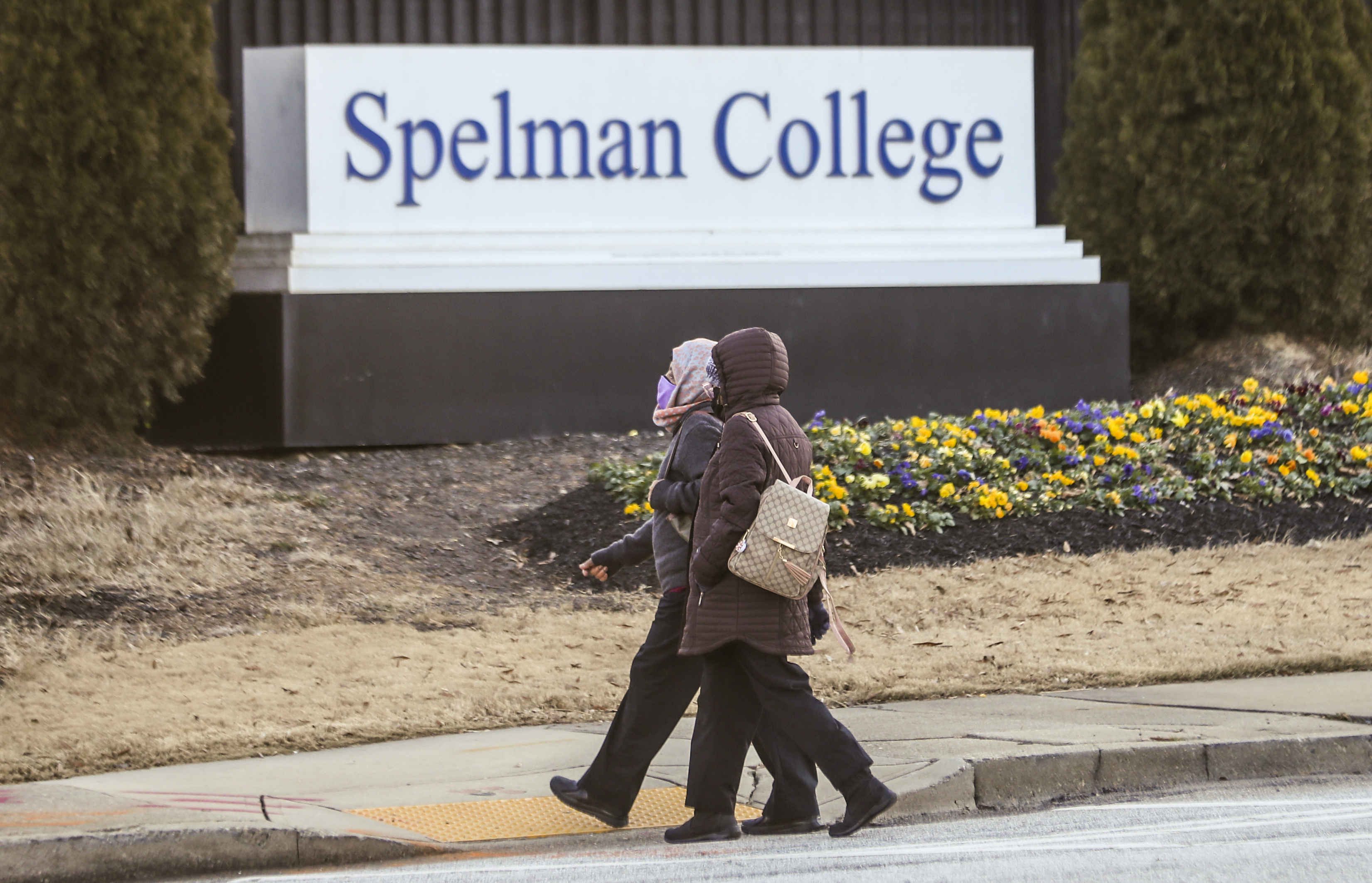 FILE - People walk outside the Spelman campus, Feb. 1, 2022, in Atlanta. (John Spink/Atlanta Journal-Constitution via AP, File)