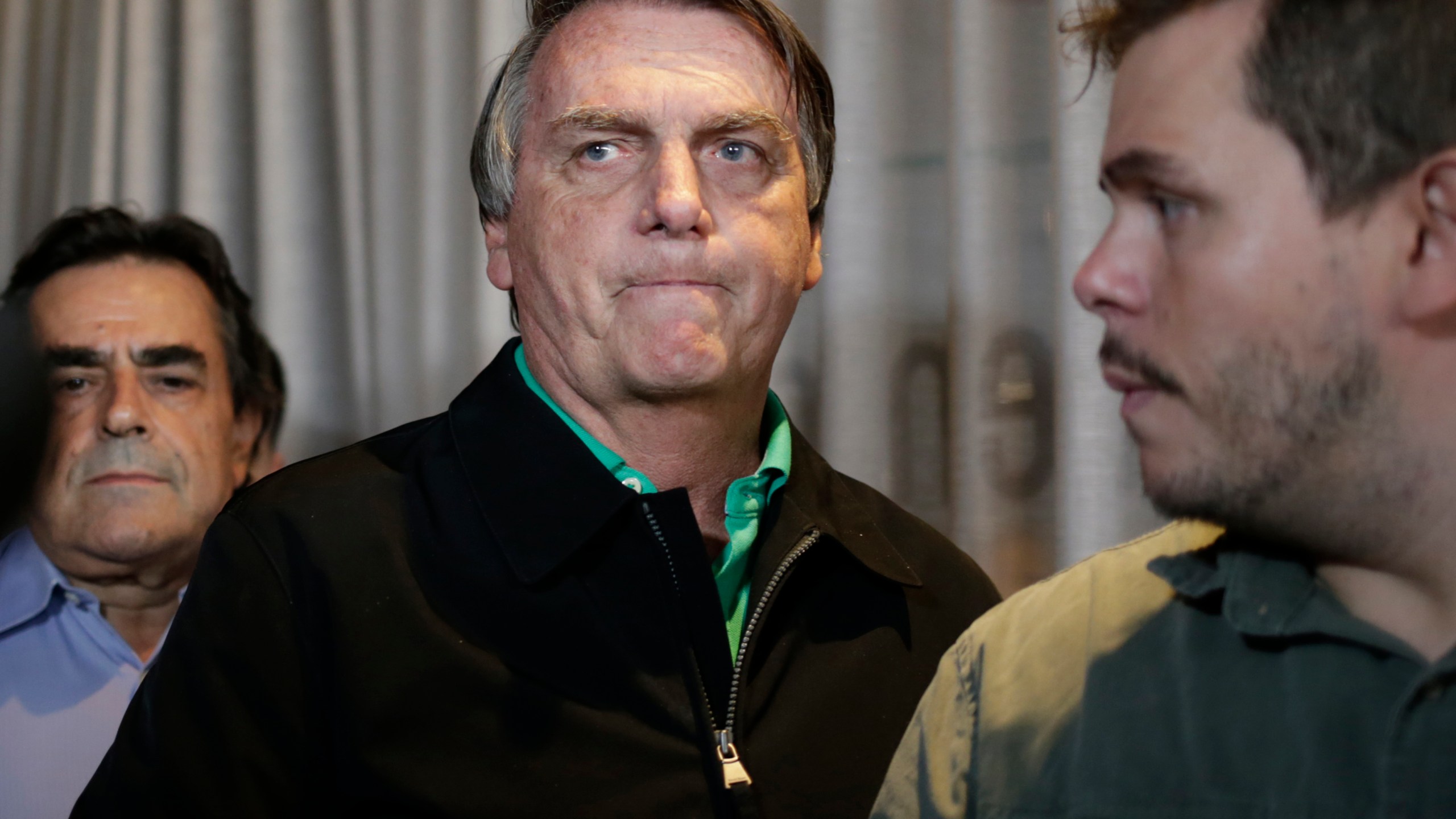 FILE - Brazil's former President Jair Bolsonaro prepares to speak to the press in Belo Horizonte, Brazil, June 30, 2023, the day that judges ruled him ineligible to run for political office until 2030 after concluding that he abused his power and cast unfounded doubts on the country's electronic voting system. (AP Photo/Thomas Santos, File)