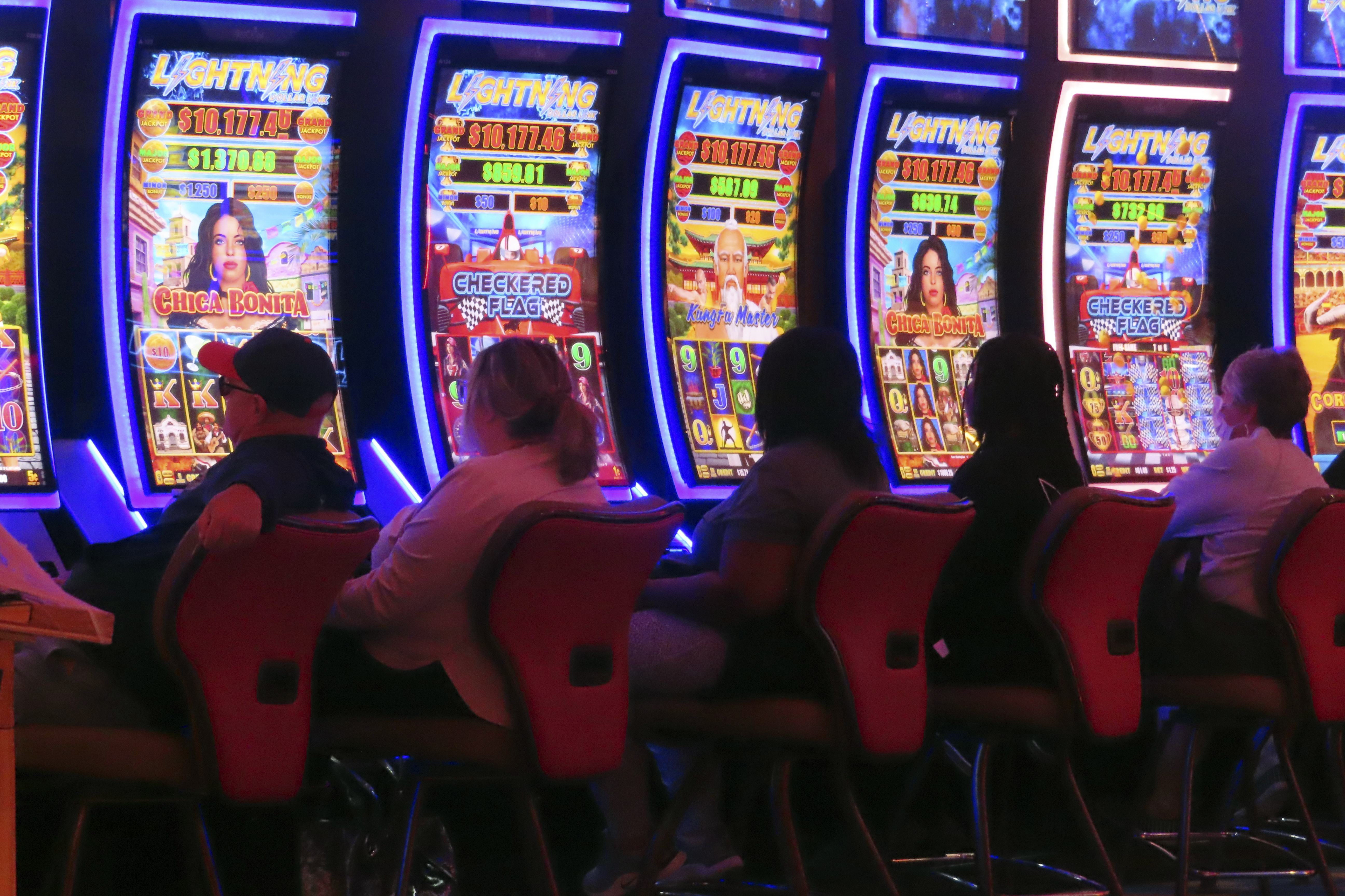 Gamblers play slot machines at the Hard Rock casino in Atlantic City, N.J., on Oct. 3, 2024. (AP Photo/Wayne Parry)