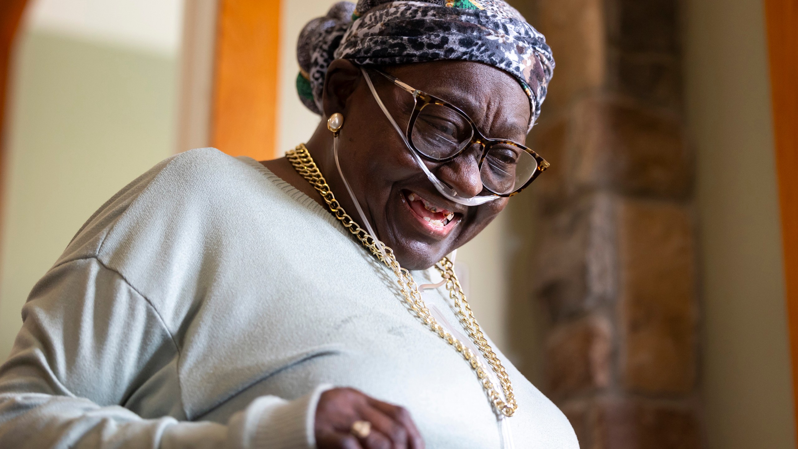 Patricia Johnican smiles as she greets a friend at Commons of Grace Senior on Wednesday, Sept. 25, 2024, in Houston. (AP Photo / Annie Mulligan)