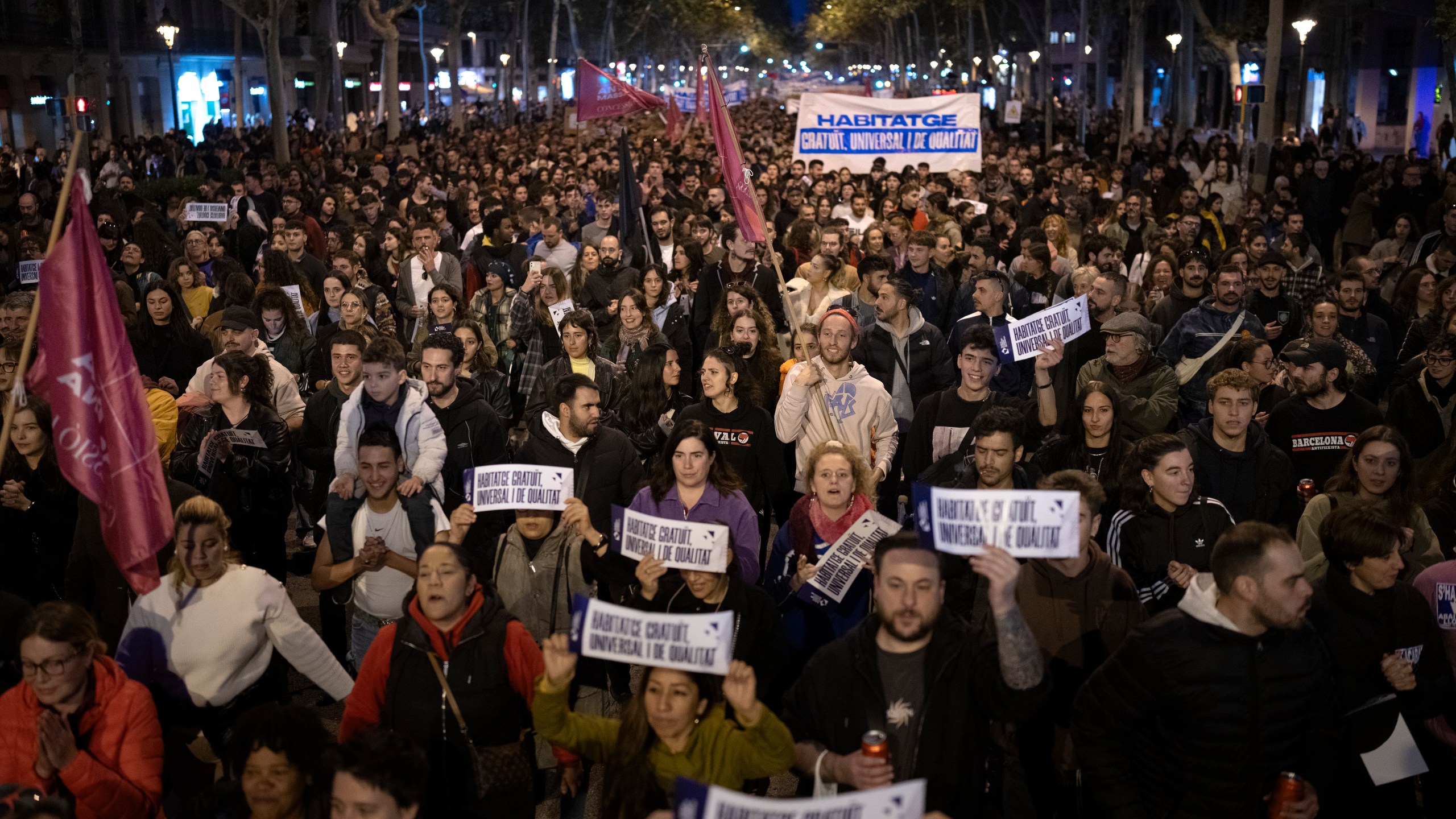 Demonstrators march to protest the skyrocketing cost of renting an apartment in Barcelona, Spain, Saturday, Nov. 23, 2024. (AP Photo/Emilio Morenatti)