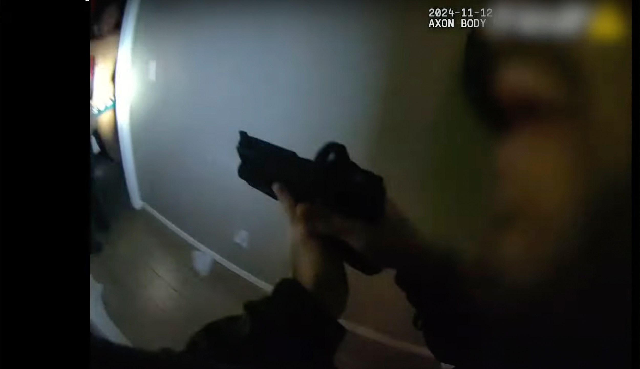 This police body camera image provided by Las Vegas Metropolitan Police shows police responding to a home invasion on Nov. 12, 2024 in Las Vegas. (Las Vegas Metropolitan Police via AP)