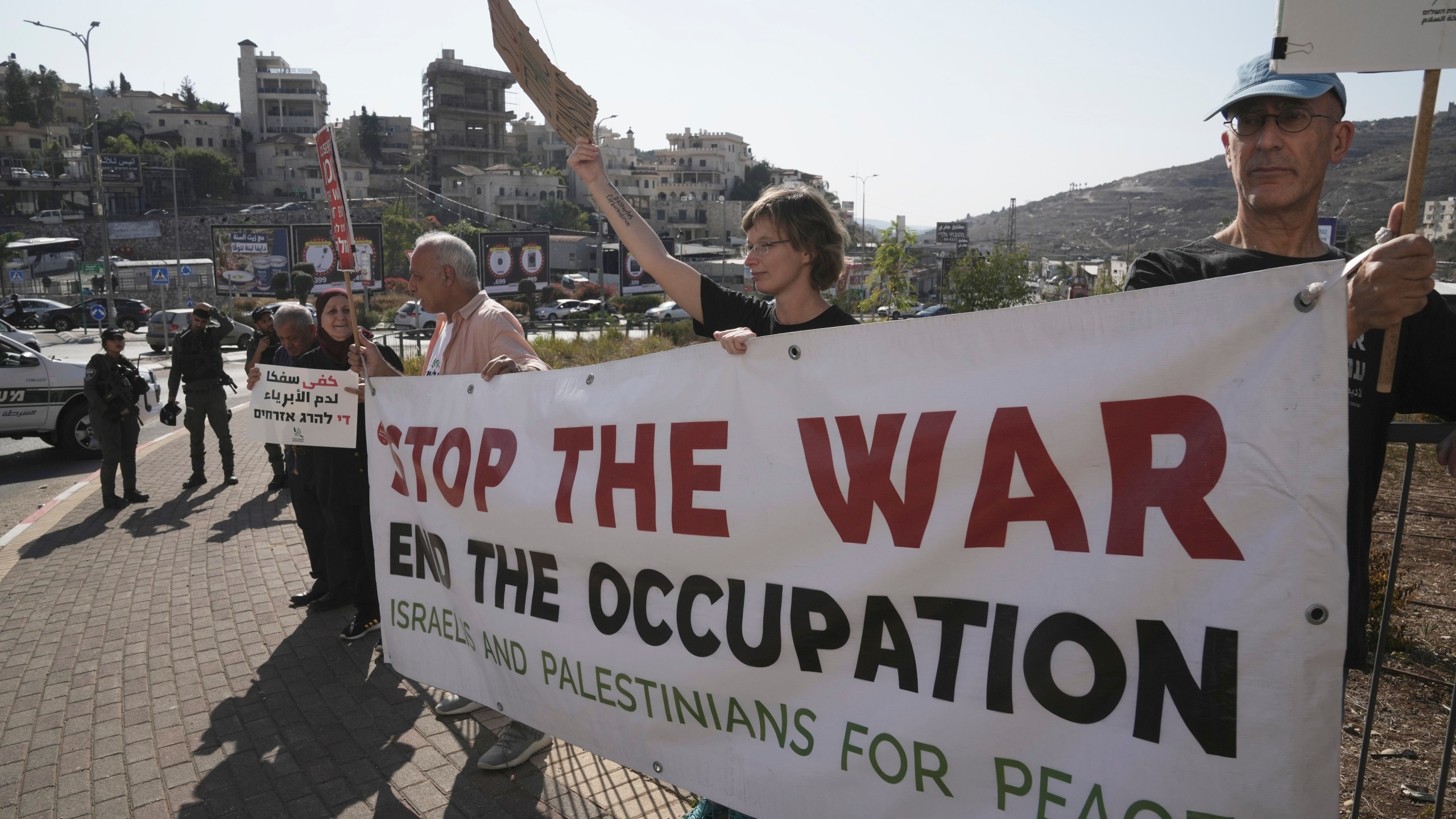 Israelis and Palestinian citizens of Israel protest Israel's military operations in the Gaza Strip, in Umm al-Fahm, Israel, Friday, Nov. 15, 2024. (AP Photo/Mahmoud Illean)