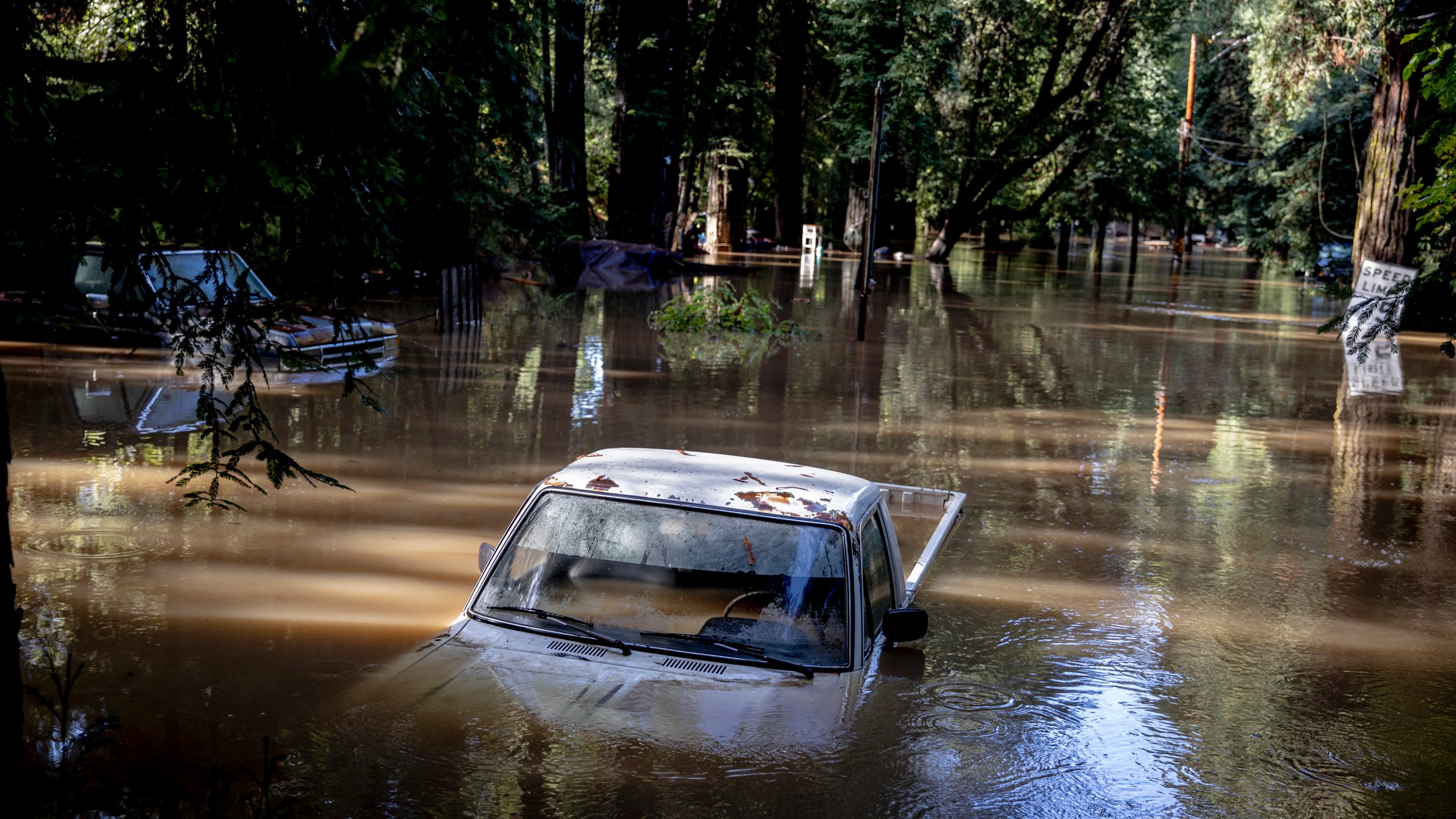 A car is seen submerged in flooded water at Mirabel RV Park & Campground after severe weather in Forestville, Calif., Saturday, Nov. 23, 2024. (Stephen Lam/San Francisco Chronicle via AP)