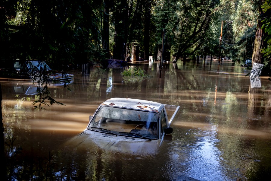 A car is seen submerged in flooded water at Mirabel RV Park & Campground after severe weather in Forestville, Calif., Saturday, Nov. 23, 2024. (Stephen Lam/San Francisco Chronicle via AP)