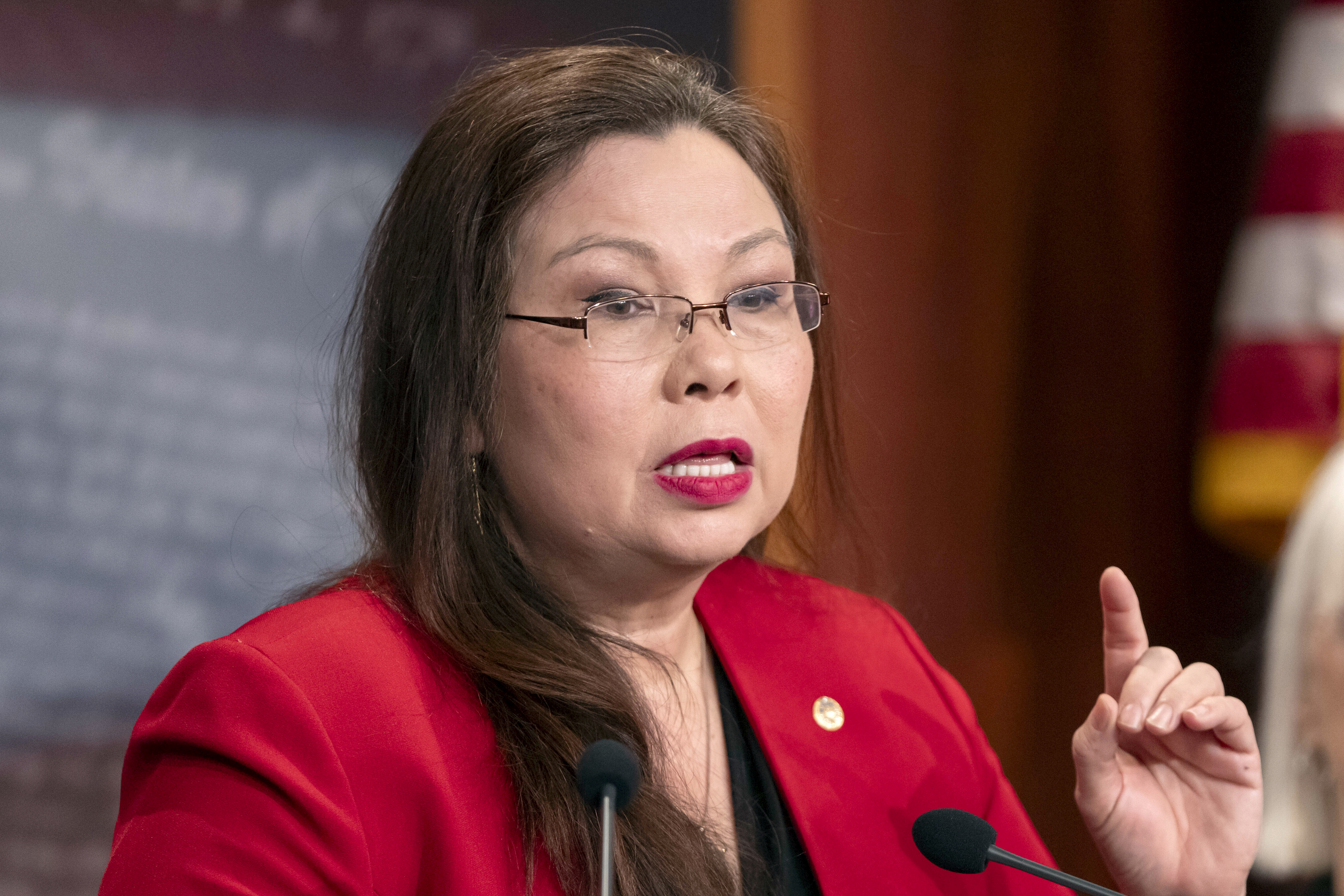 FILE - Sen. Tammy Duckworth, D-Ill., speaks during a press event on Capitol Hill, Feb. 27, 2024, in Washington. (AP Photo/Mark Schiefelbein, File)