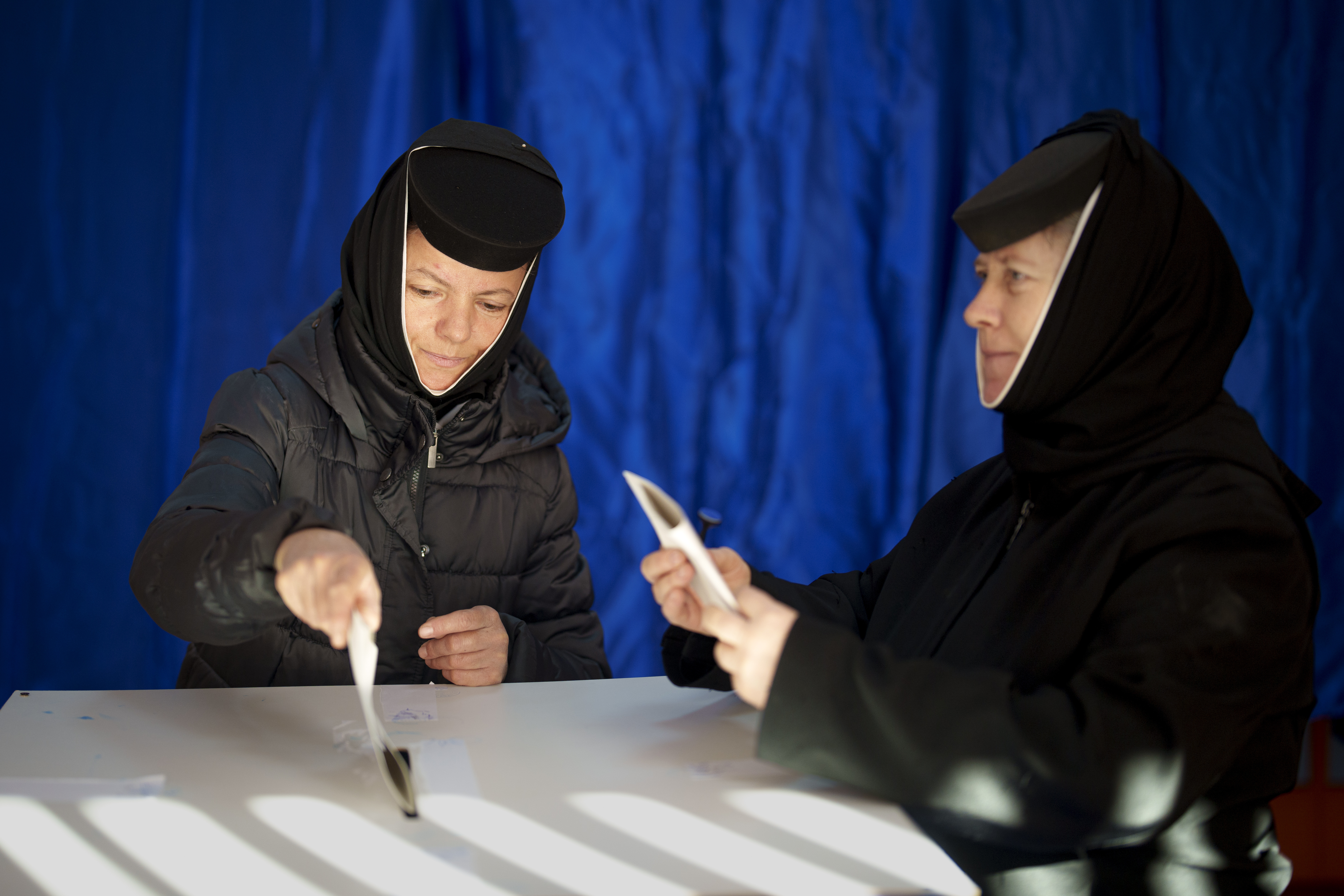 Orthodox nuns cast their vote in the country's presidential elections, in Pasarea, Romania, Sunday, Nov. 24, 2024. (AP Photo/Vadim Ghirda)