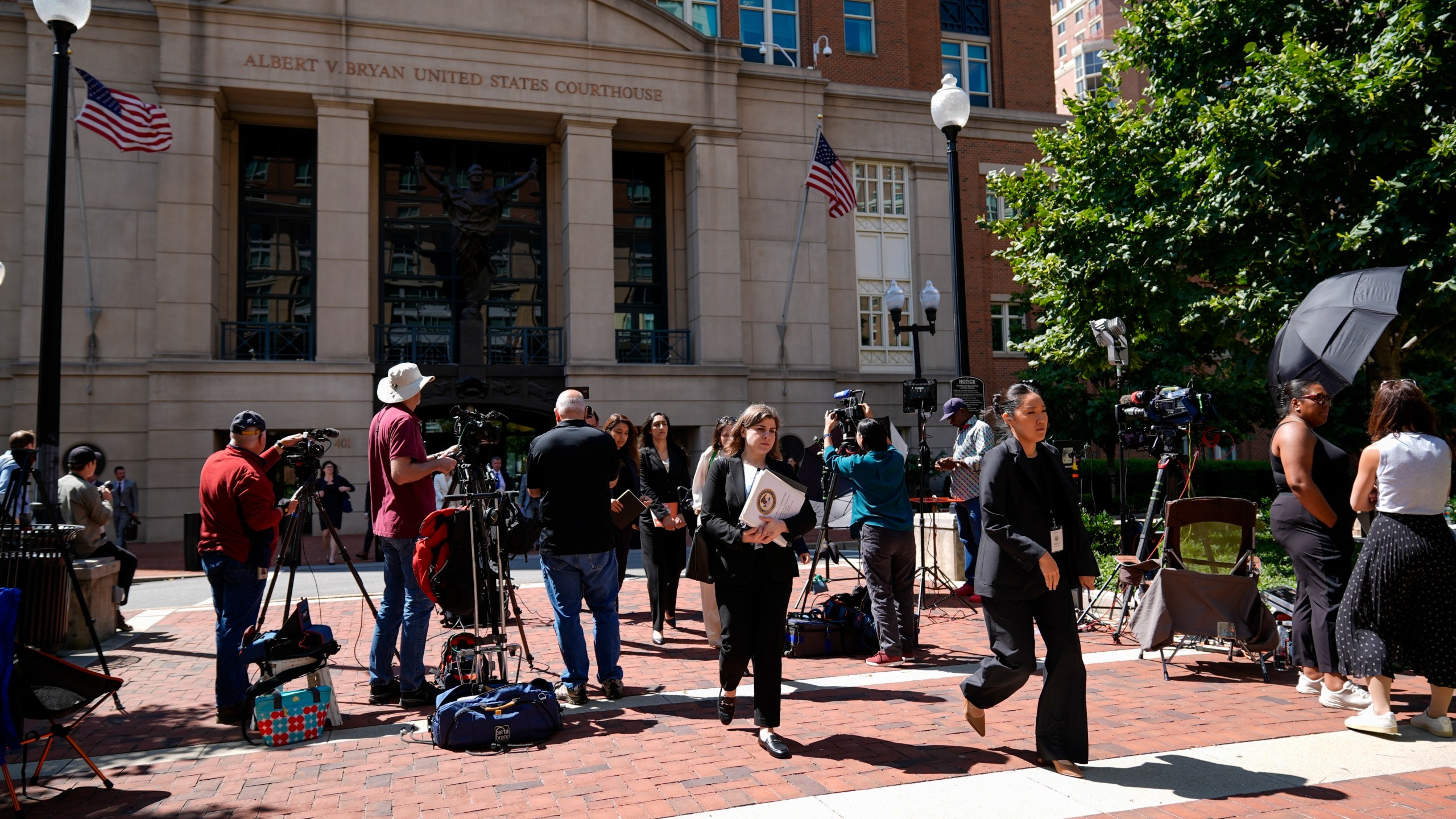 FILE - Lawyers and legal assistants leave the U.S. District Court for the Eastern District of Virginia for a lunch break in the Department of Justice's antitrust trial against tech giant Google, Sept. 9, 2024, in Alexandria, Va. (AP Photo/Stephanie Scarbrough, File)