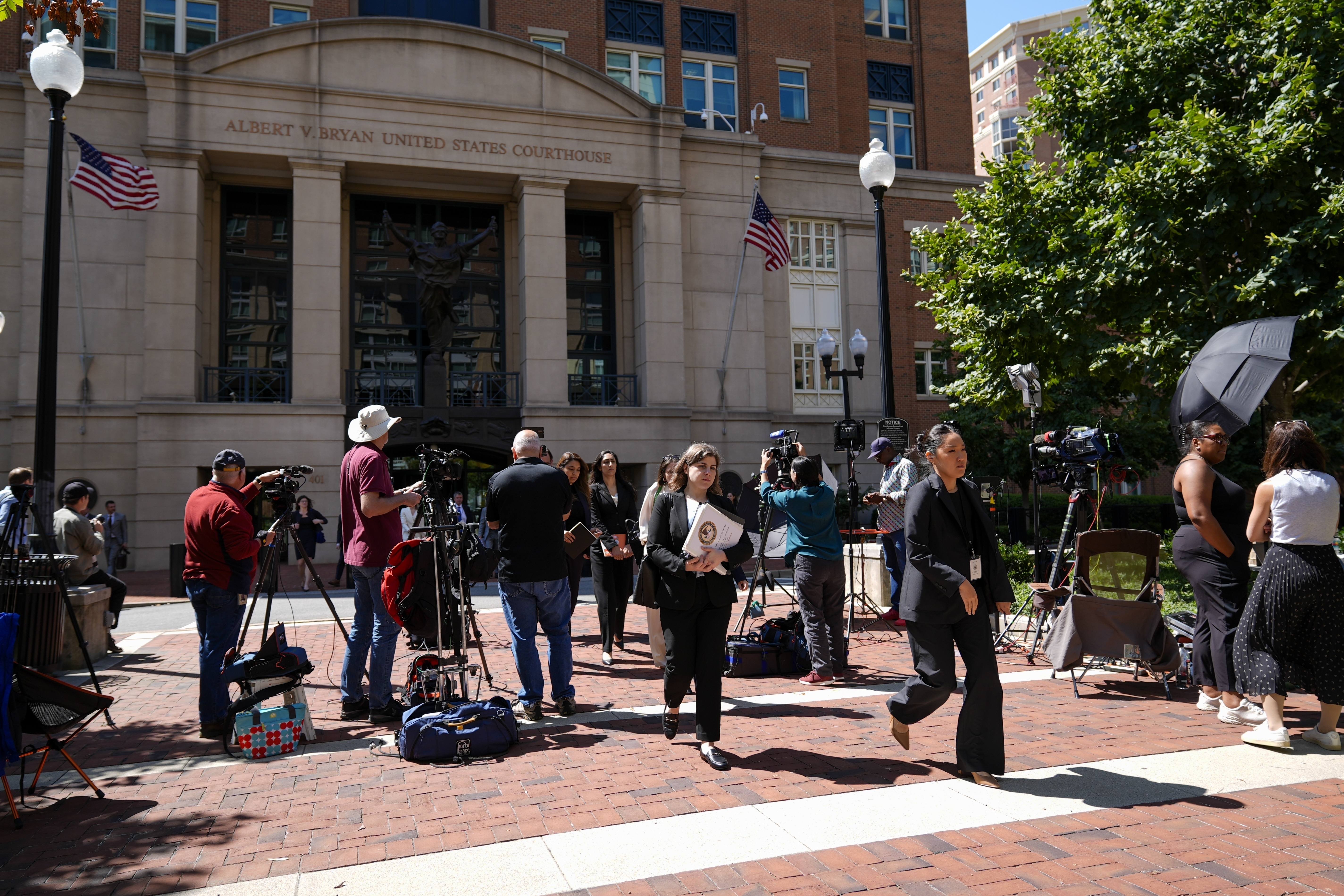 FILE - Lawyers and legal assistants leave the U.S. District Court for the Eastern District of Virginia for a lunch break in the Department of Justice's antitrust trial against tech giant Google, Sept. 9, 2024, in Alexandria, Va. (AP Photo/Stephanie Scarbrough, File)