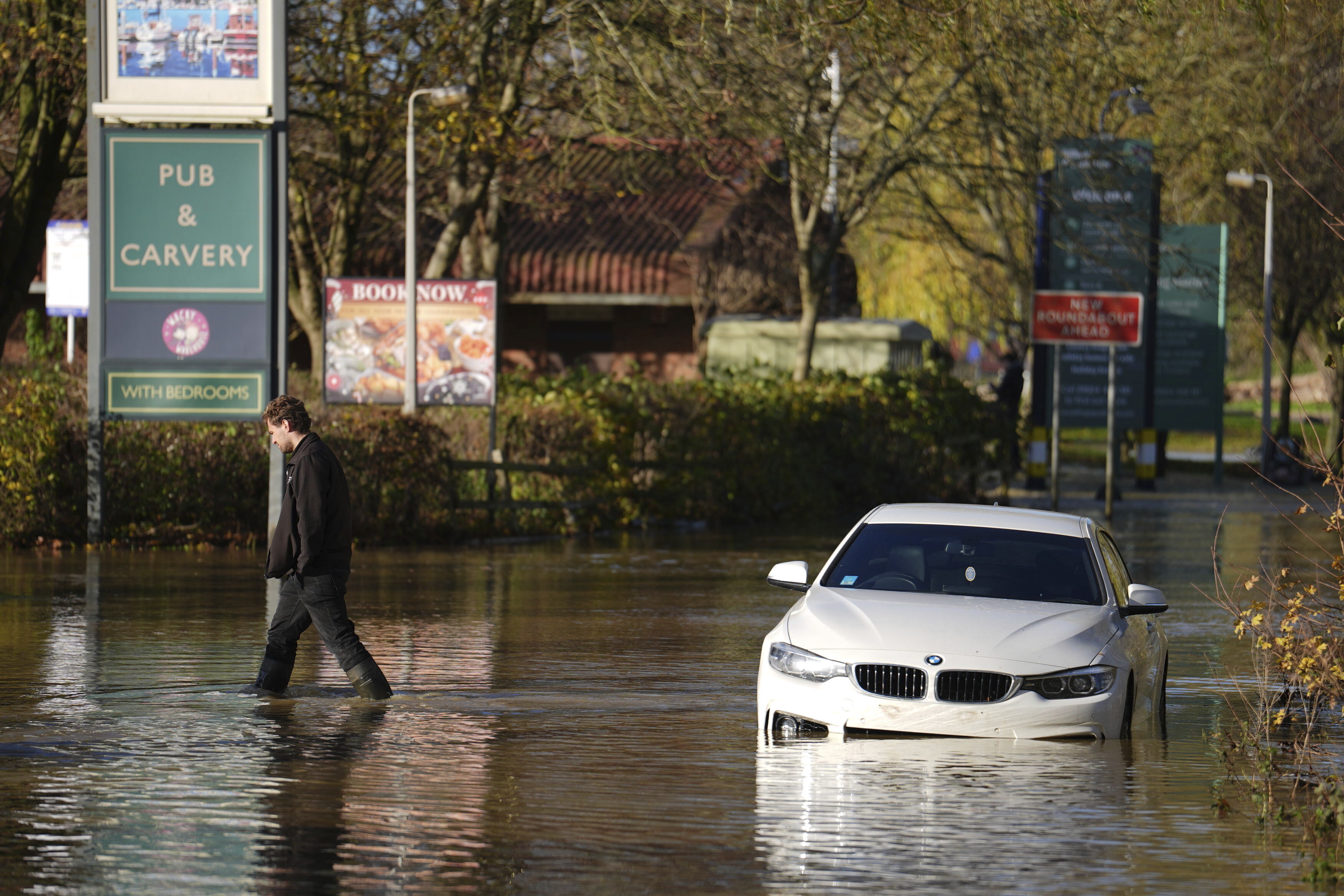 A stranded car in flood water at the Billing Aquadrome as Storm Bert continues to cause disruption, in Northampton, England, Monday, Nov. 25, 2024. (Jordan Pettitt/PA via AP)