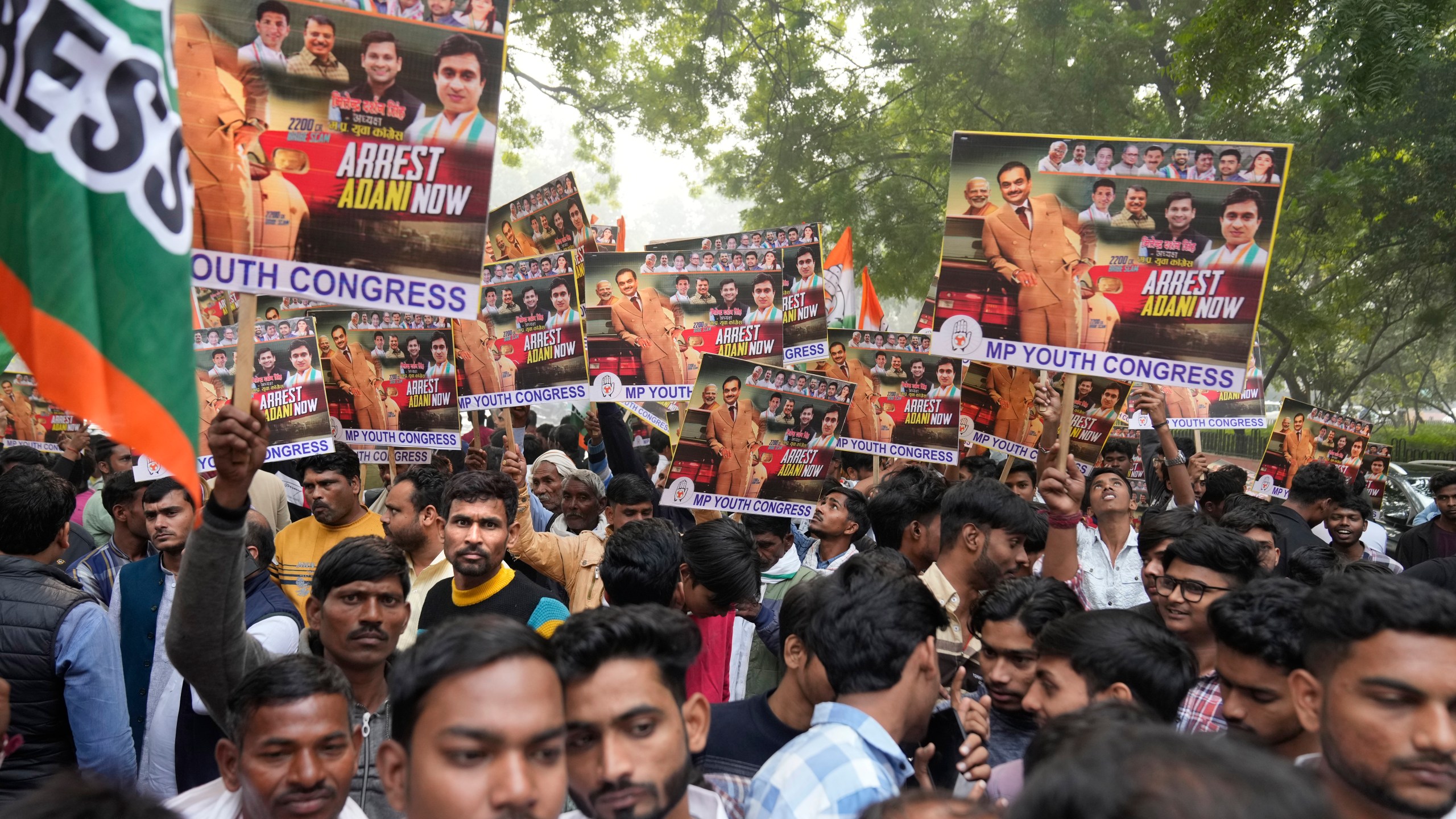 India's opposition Congress party members shout slogans during a protest against Indian billionaire Gautam Adani and Indian Prime Minister Narendra Modi after Adani was indicted by U.S. prosecutors for bribery and fraud, in New Delhi, India, Monday, Nov. 25, 2024. (AP Photo/Manish Swarup)