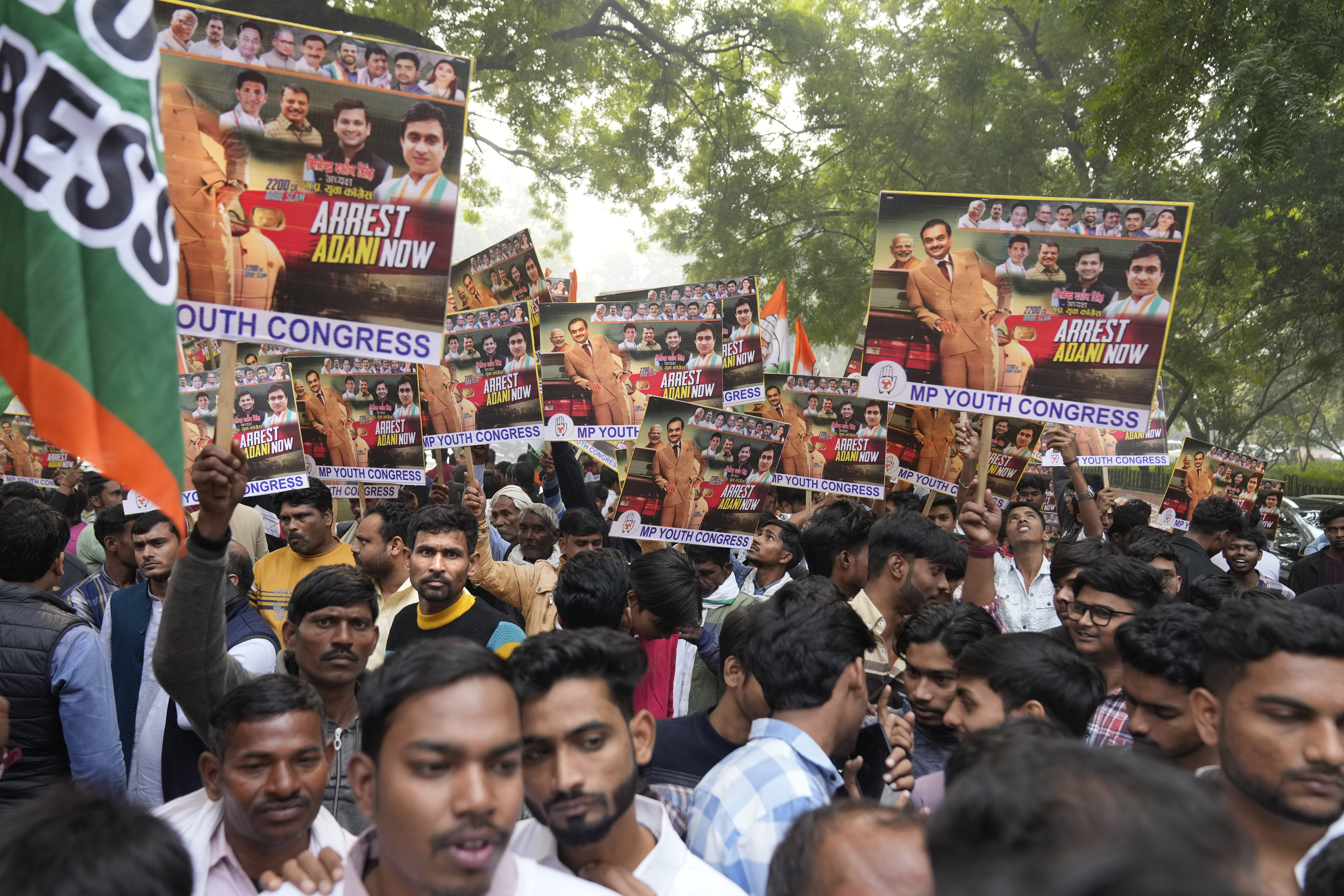 India's opposition Congress party members shout slogans during a protest against Indian billionaire Gautam Adani and Indian Prime Minister Narendra Modi after Adani was indicted by U.S. prosecutors for bribery and fraud, in New Delhi, India, Monday, Nov. 25, 2024. (AP Photo/Manish Swarup)