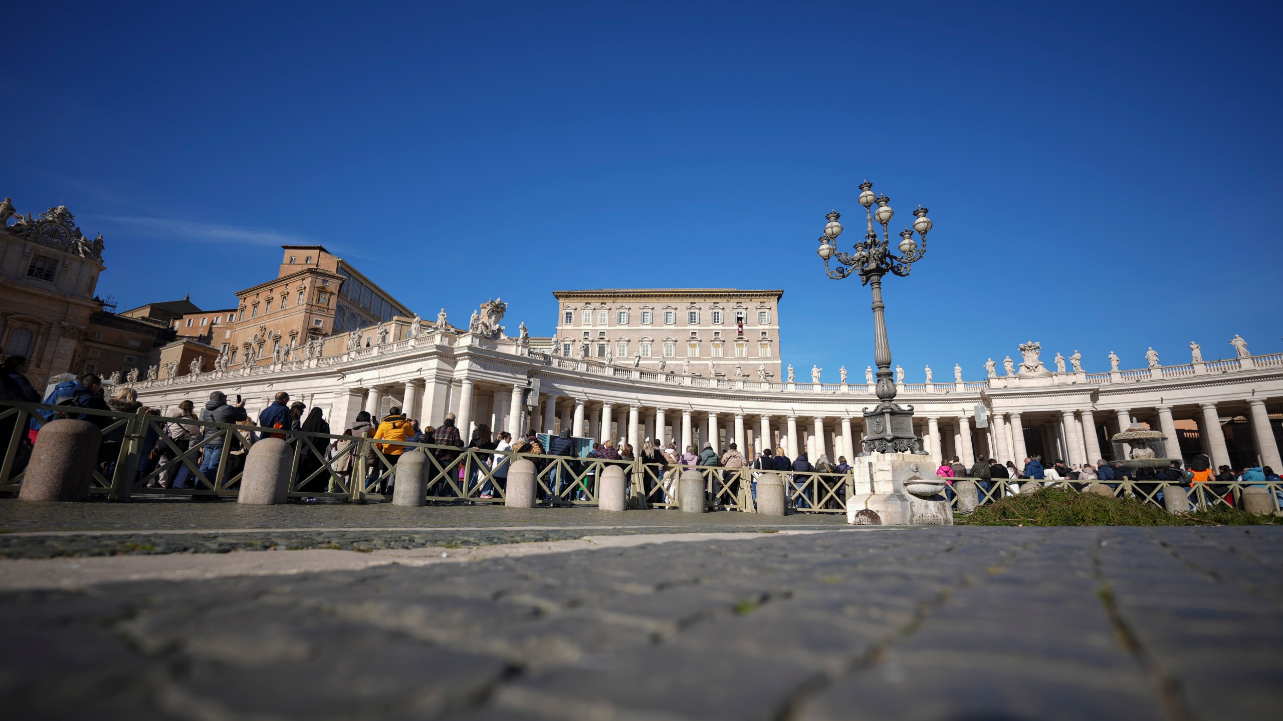 Pope Francis delivers his blessing as he recites the Angelus noon prayer from the window of his studio overlooking St.Peter's Square, at the Vatican, Sunday, Nov. 24, 2024. (AP Photo/Andrew Medichini)