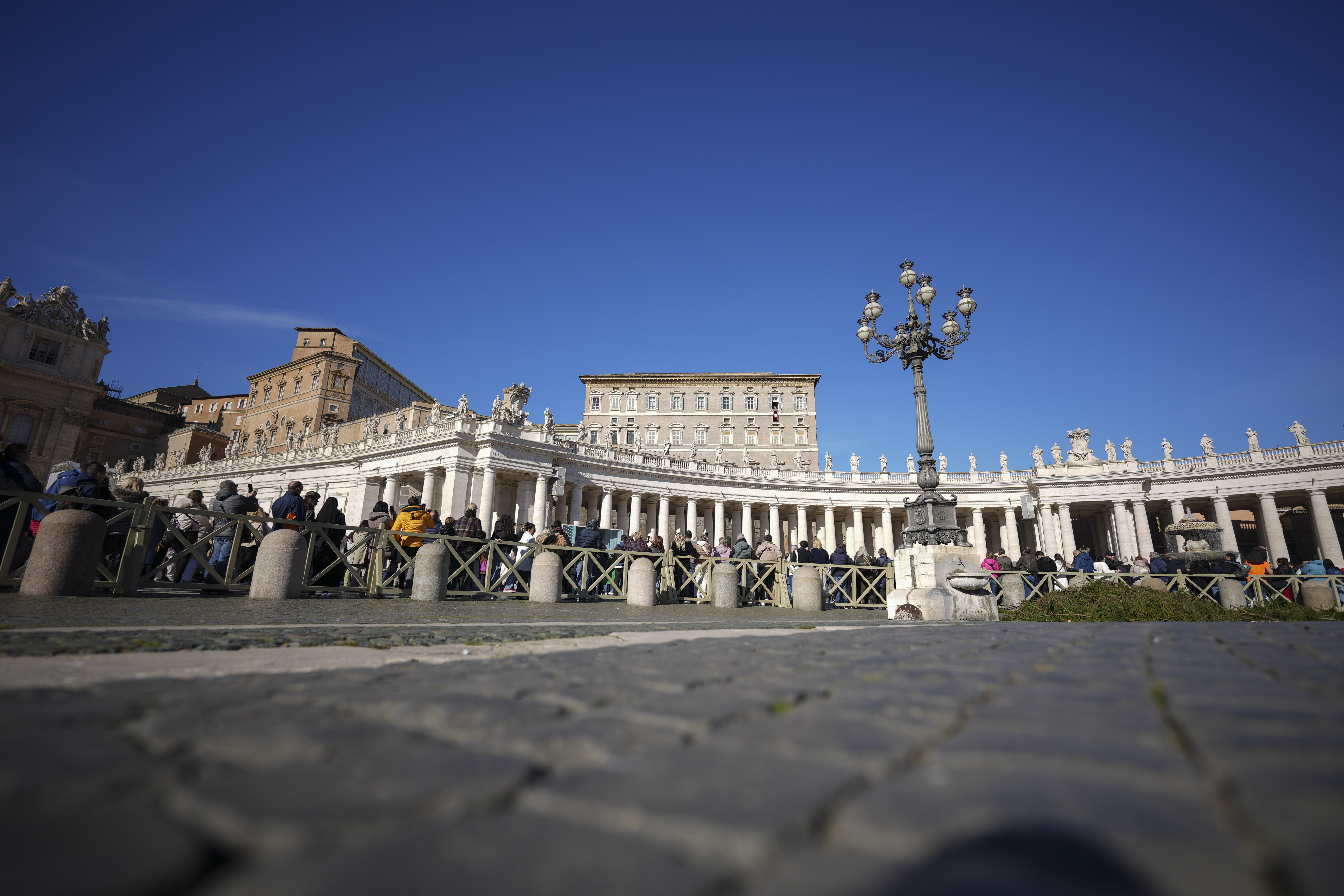 Pope Francis delivers his blessing as he recites the Angelus noon prayer from the window of his studio overlooking St.Peter's Square, at the Vatican, Sunday, Nov. 24, 2024. (AP Photo/Andrew Medichini)