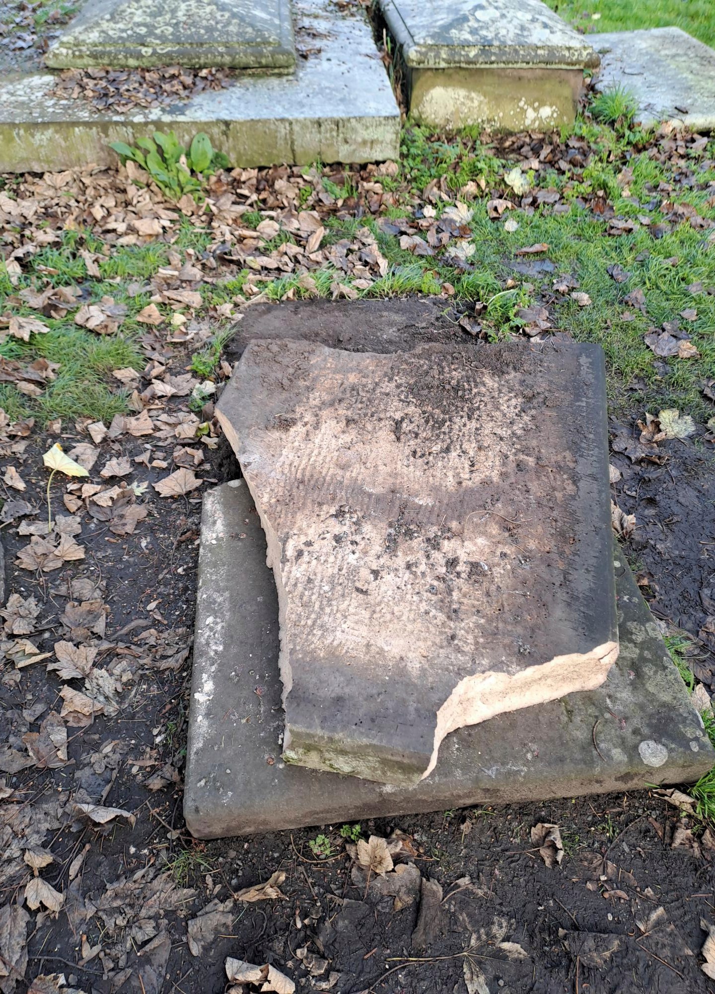 In this picture, provided by the West Mercia Police on Monday, Nov. 25, 2024, a smashed movie prop tombstone that was used for the "A Christmas Carol" movie is seen in Shrewsbury, England. (West Mercia Police via AP)