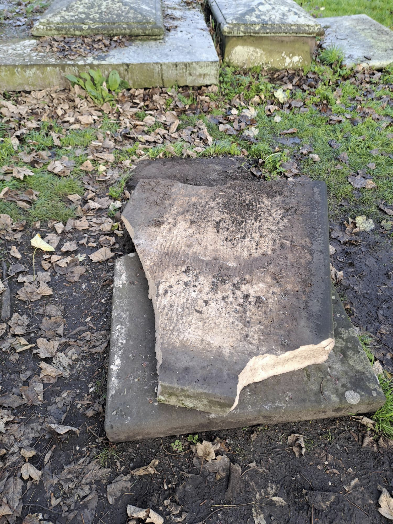 In this picture, provided by the West Mercia Police on Monday, Nov. 25, 2024, a smashed movie prop tombstone that was used for the "A Christmas Carol" movie is seen in Shrewsbury, England. (West Mercia Police via AP)