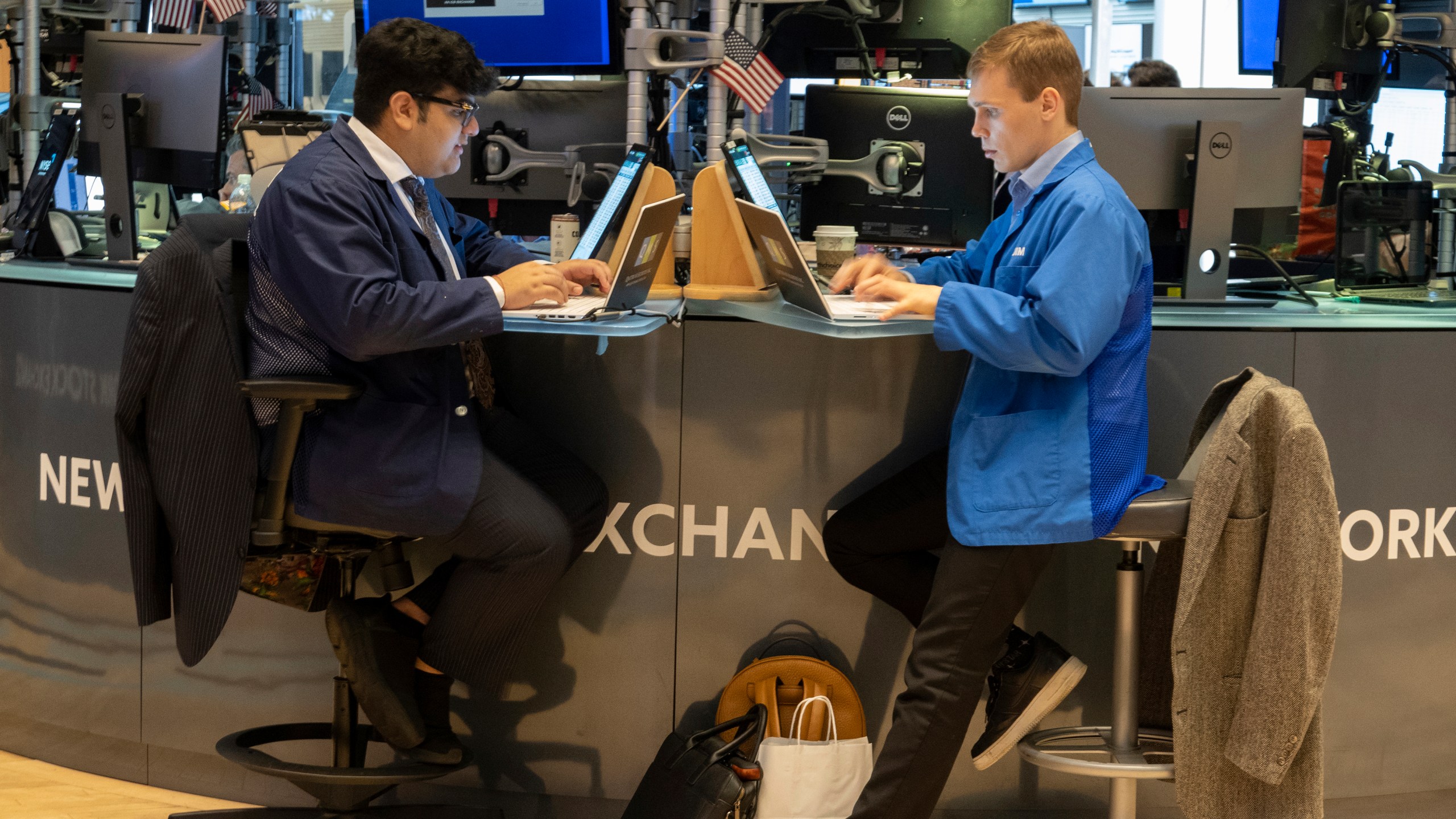 FILE - People work on the New York Stock Exchange trading floor in New York on November 21, 2024. (AP Photo/Ted Shaffrey, File)