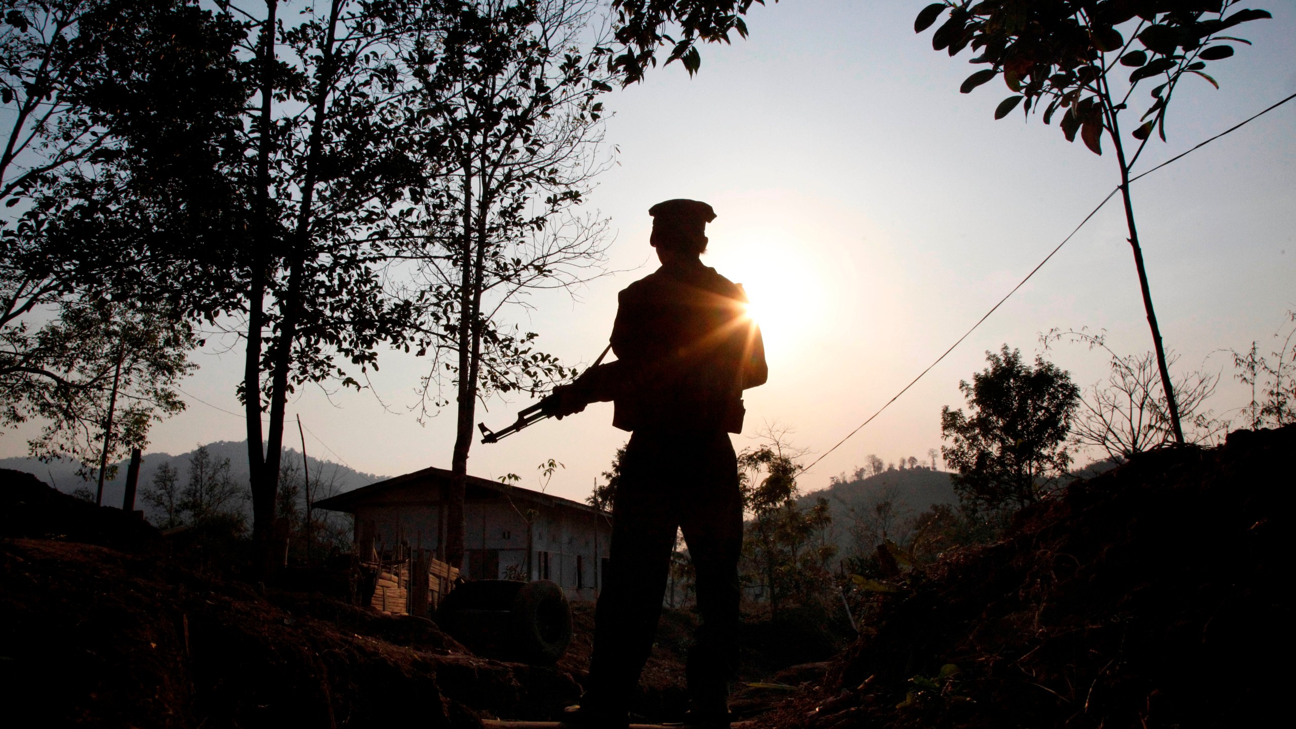 FILE- A Kachin Independence army rebel stands at frontline outpost facing no man's land in Lawa Yang, outside of Laiza, the armed group's headquarters in northern Kachin state, Myanmar, March 20, 2018. (AP Photo/Esther Htusan, File)