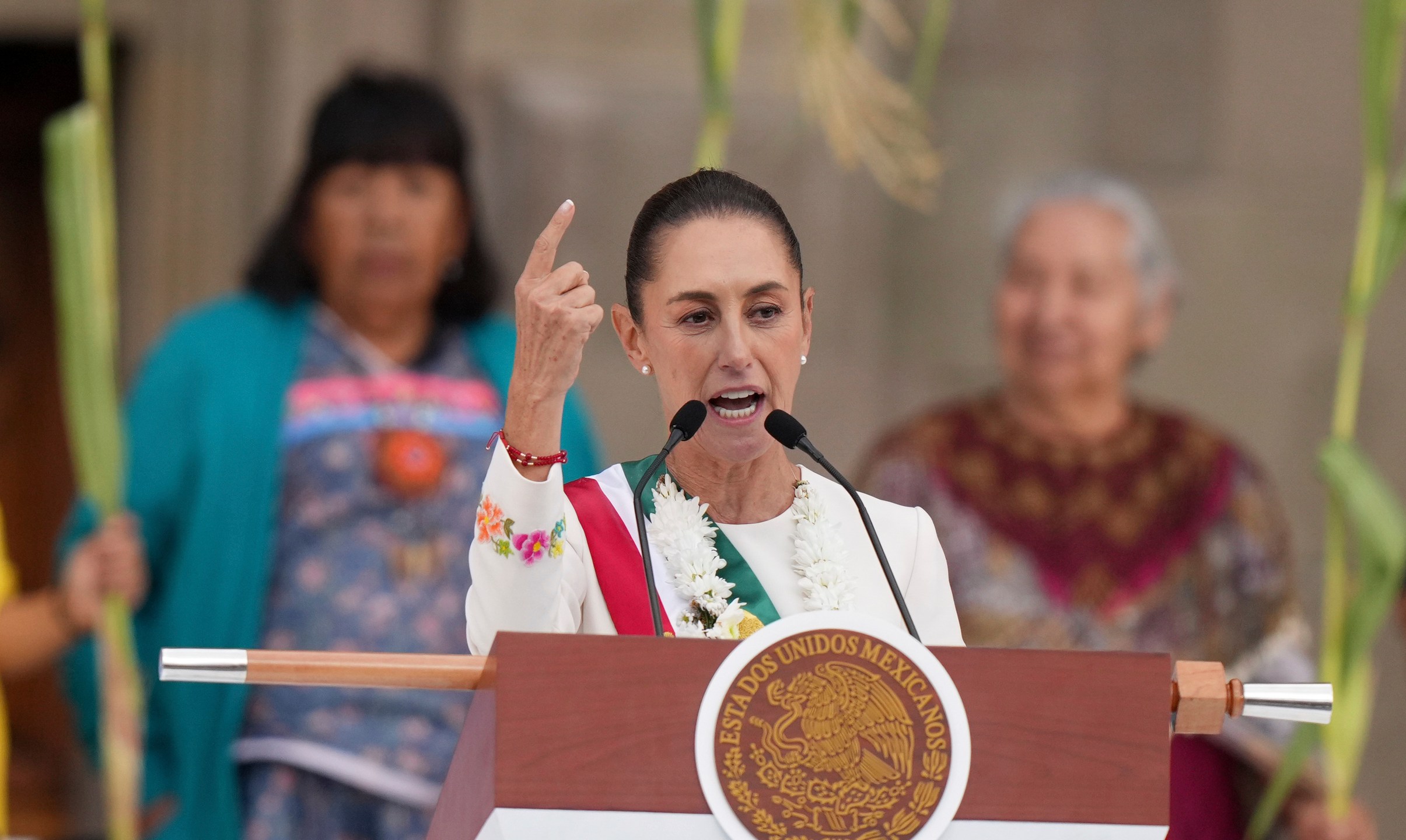 FILE - Newly-sworn in President Claudia Sheinbaum addresses supporters in the Zócalo, Mexico City's main square, on Oct. 1, 2024. (AP Photo/Fernando Llano, File)