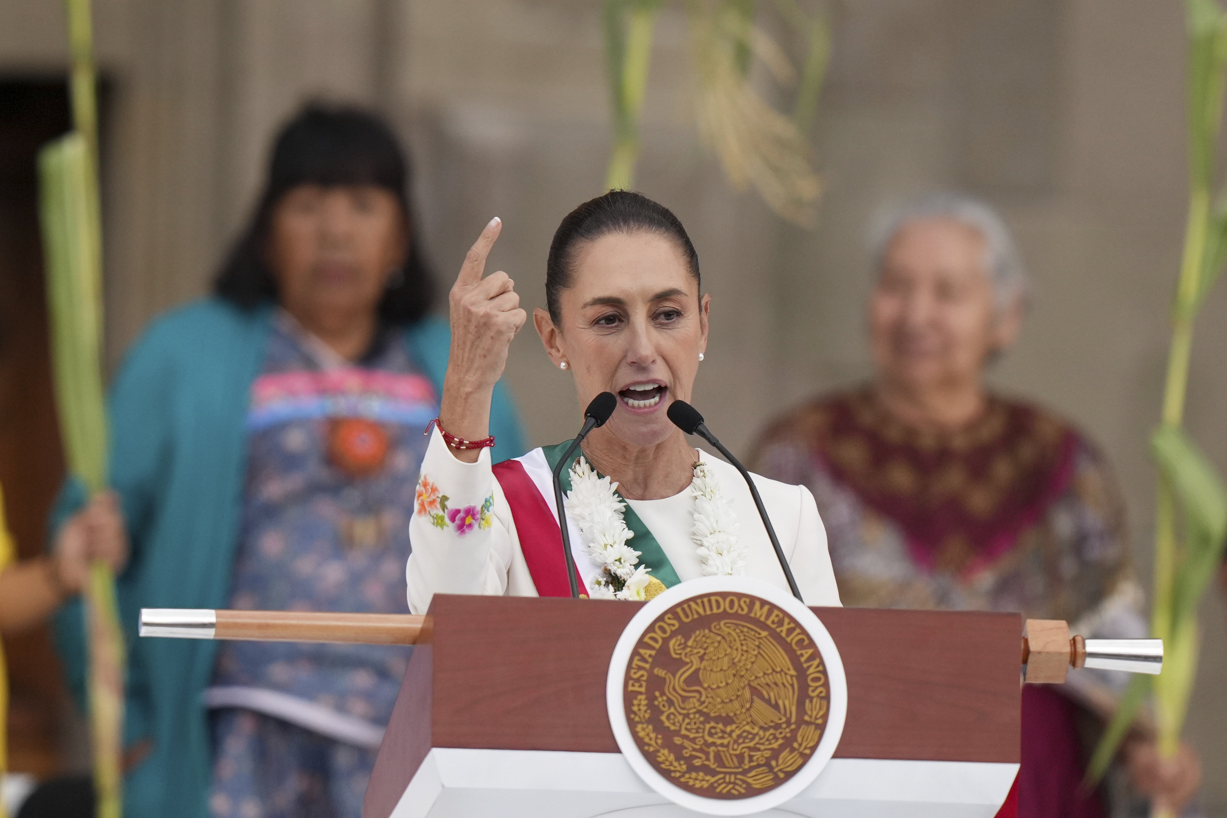 FILE - Newly-sworn in President Claudia Sheinbaum addresses supporters in the Zócalo, Mexico City's main square, on Oct. 1, 2024. (AP Photo/Fernando Llano, File)