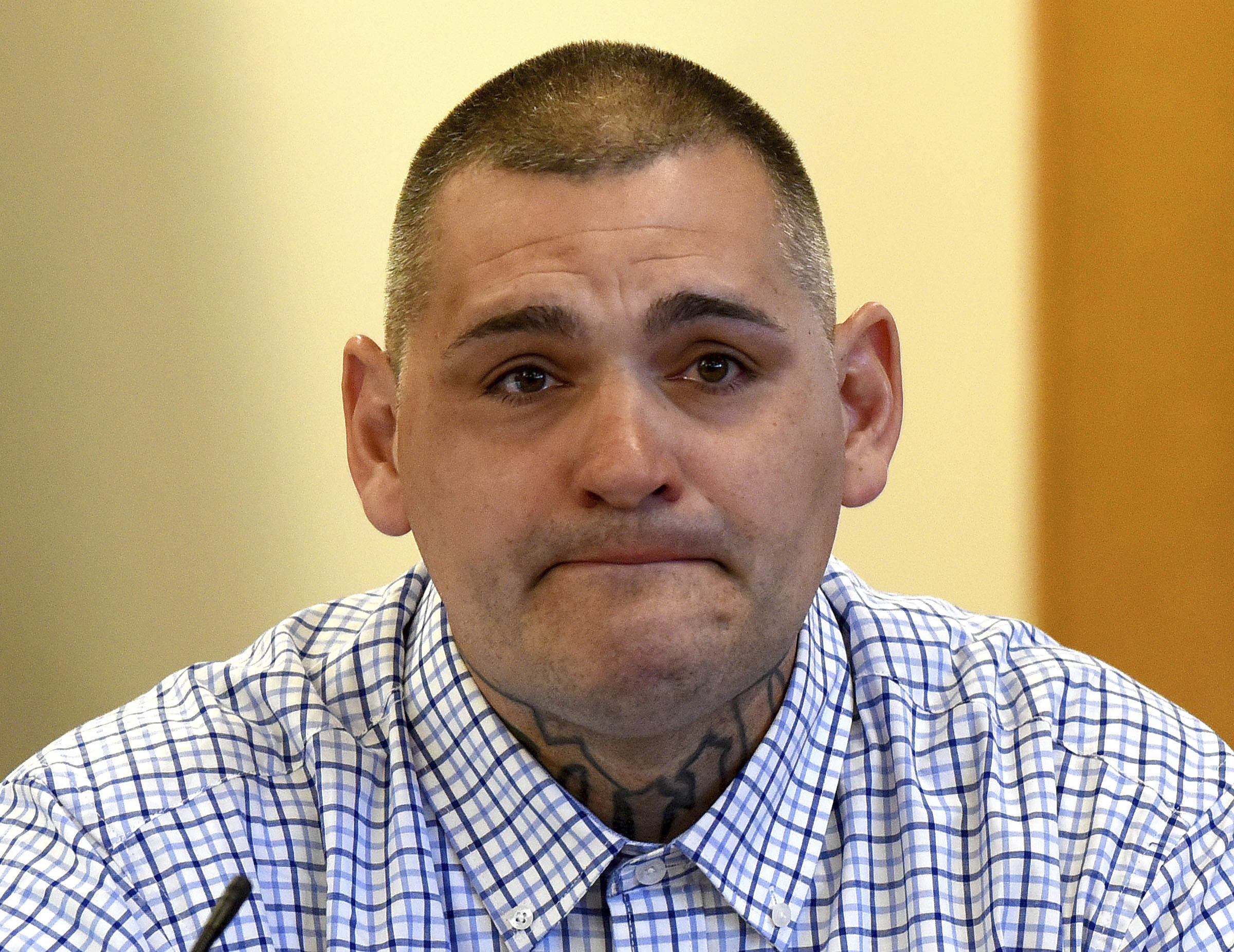 FILE - Michael Gilpatrick, a former youth detention center resident, fights back tears as testifies during a civil trial seeking to hold the state accountable for alleged abuse at the Sununu Youth Services Center, formerly called the Youth Development Center, April 17, 2024, at Rockingham County Superior Court in Brentwood, N.H. (David Lane/Union Leader via AP, Pool, File)