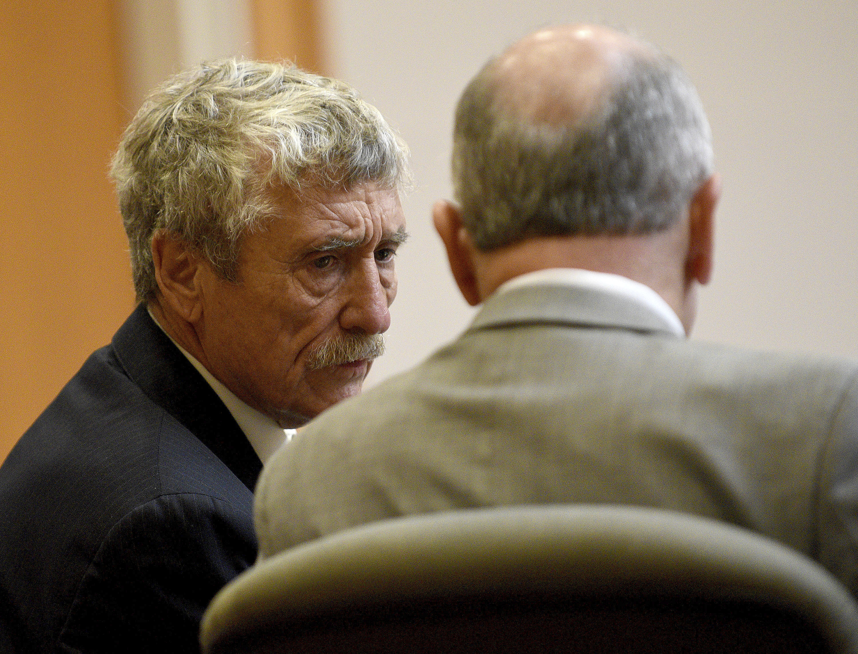 Defendant Bradley Asbury, left, accused of holding down a teenage boy so colleagues could rape him at a New Hampshire youth center in the 1990s, confers with his attorney David Rothstein during opening statements for his trial at Hillsborough County Superior Court in Manchester, N.H.,, Tuesday, Nov. 19, 2024. (David Lane/Union Leader via AP, Pool)