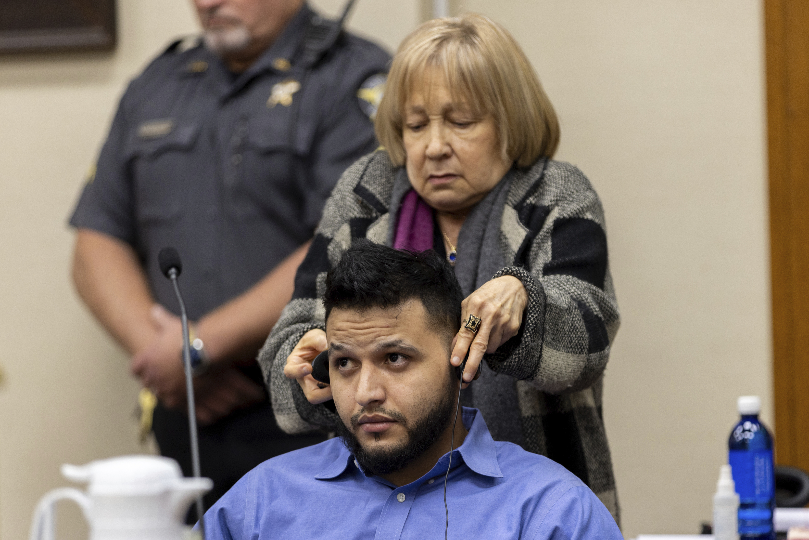 FILE - A translator assists Venezuelan Jose Ibarra with headphones during his murder trial at the Athens-Clarke County Superior Court, in Athens, Ga., Nov. 19, 2024. (Arvin Temkar/Atlanta Journal-Constitution via AP File)