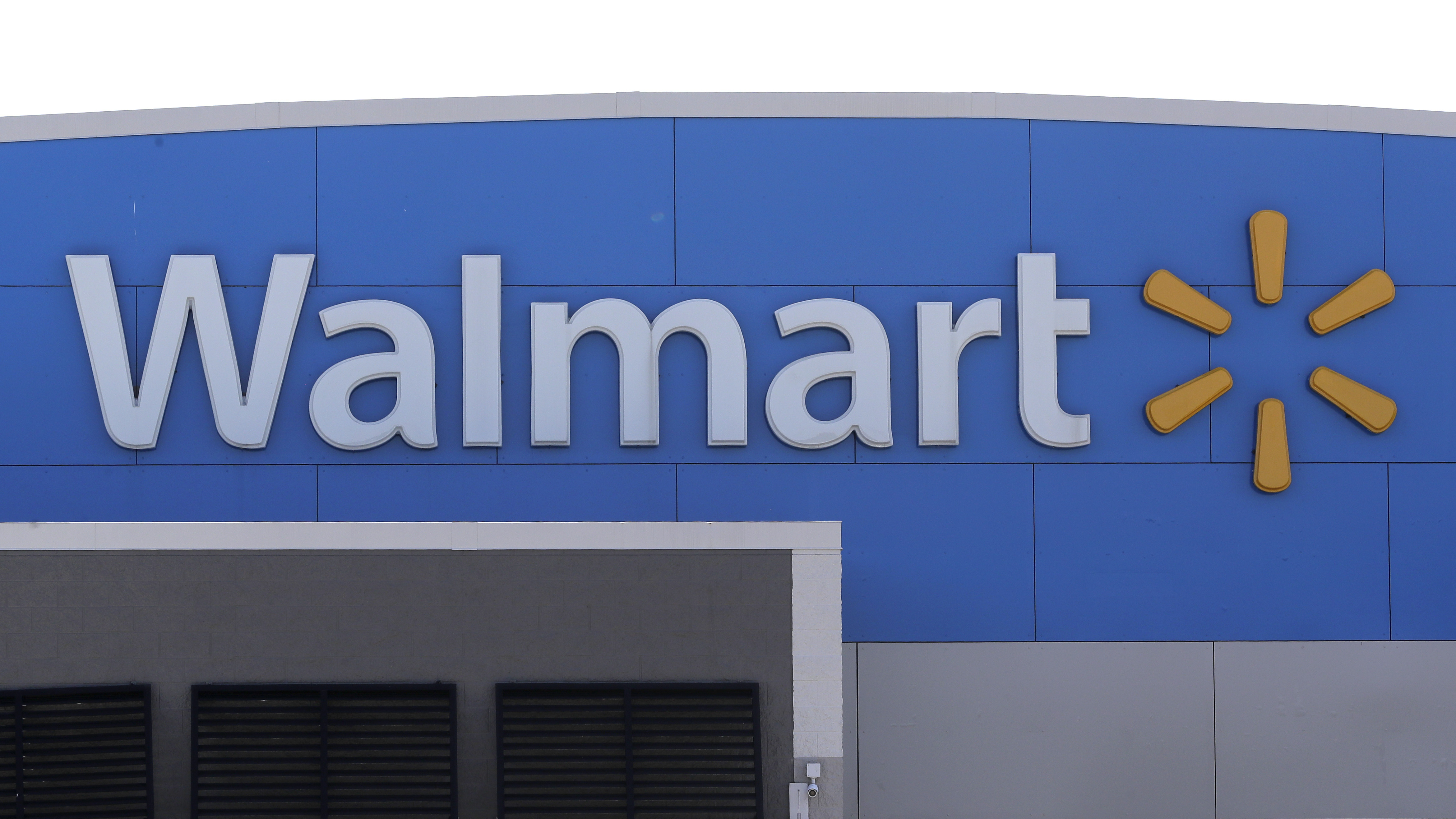 FILE - A Walmart logo is displayed outside of a Walmart store, in Walpole, Mass., Sept. 3, 2019. (AP Photo/Steven Senne, File)