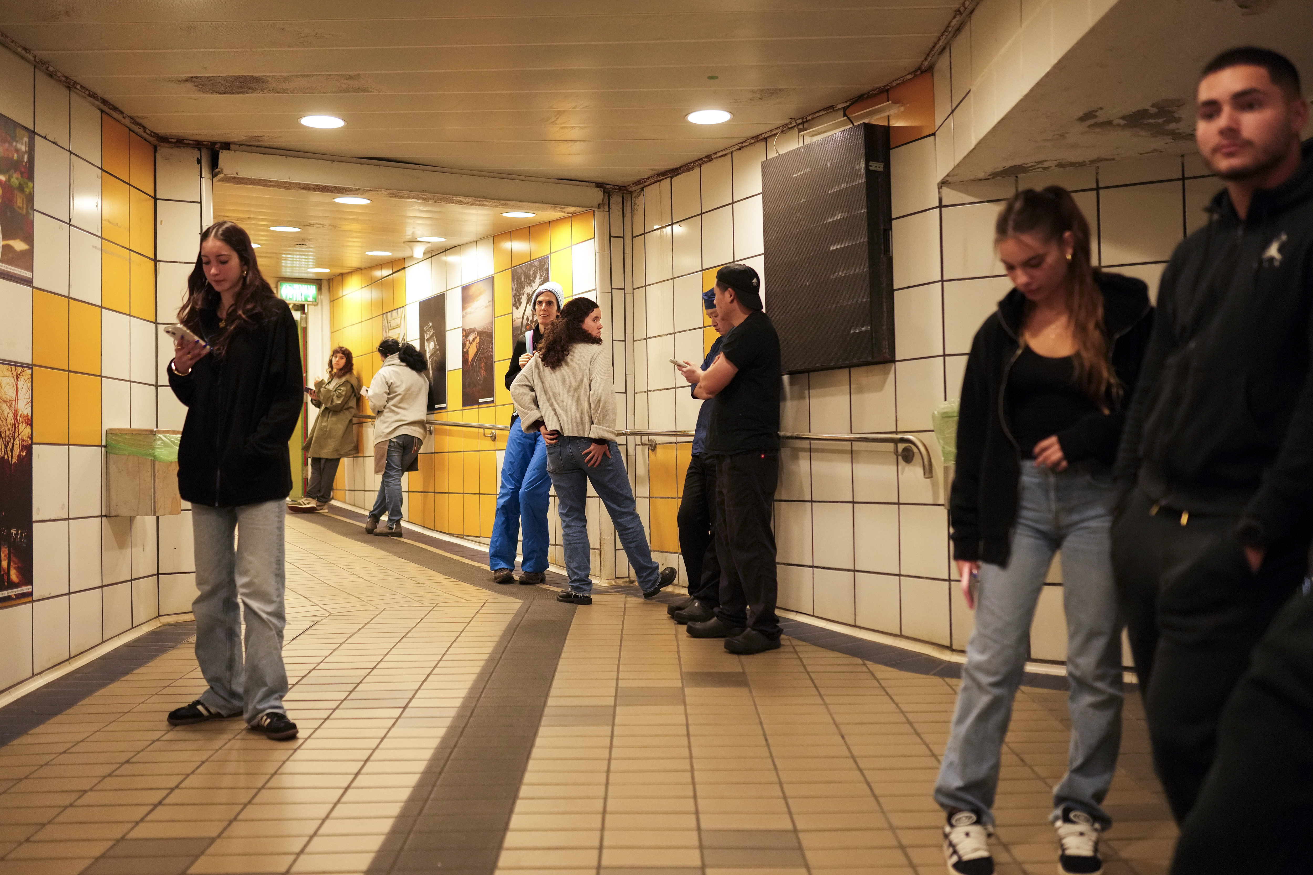 People take shelter in a metro station as a siren sounds a warning of incoming rockets from Lebanon in Haifa, Tuesday, Nov. 26, 2024. (AP Photo/Francisco Seco)