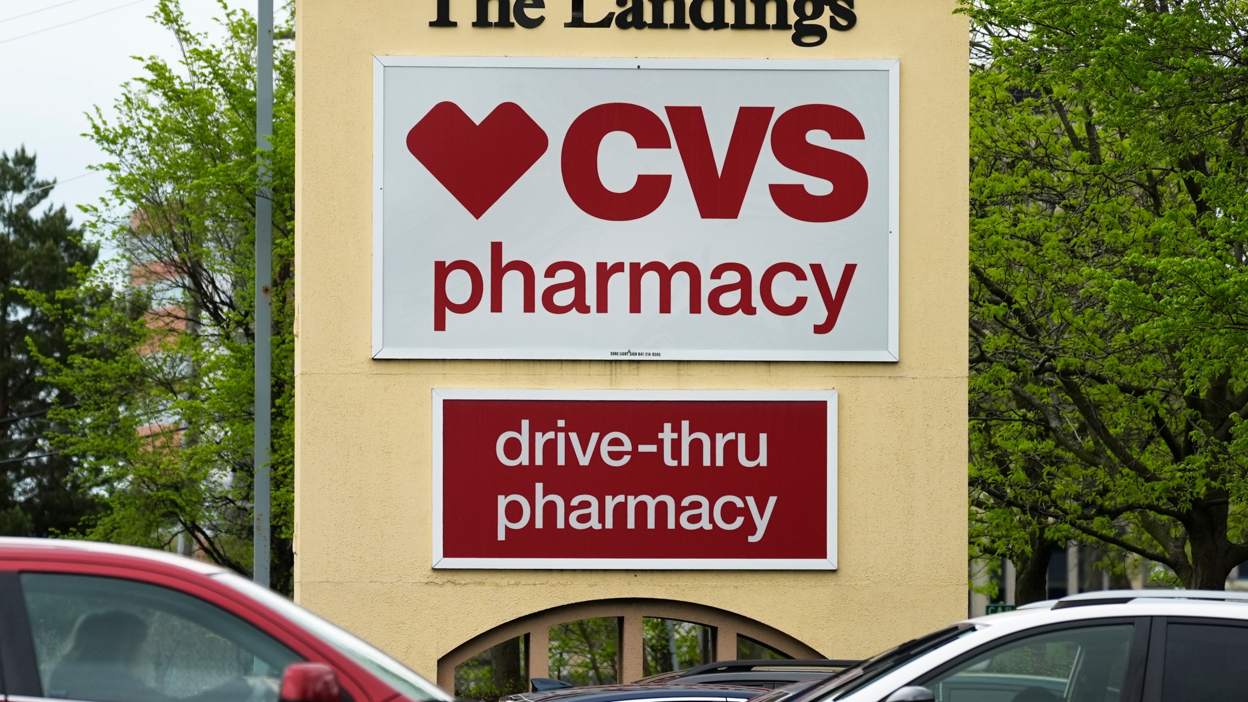 FILE - CVS pharmacy and drive-thru signs are seen outside of a CVS store in Park Ridge, Ill., April 29, 2024. (AP Photo/Nam Y. Huh, File)