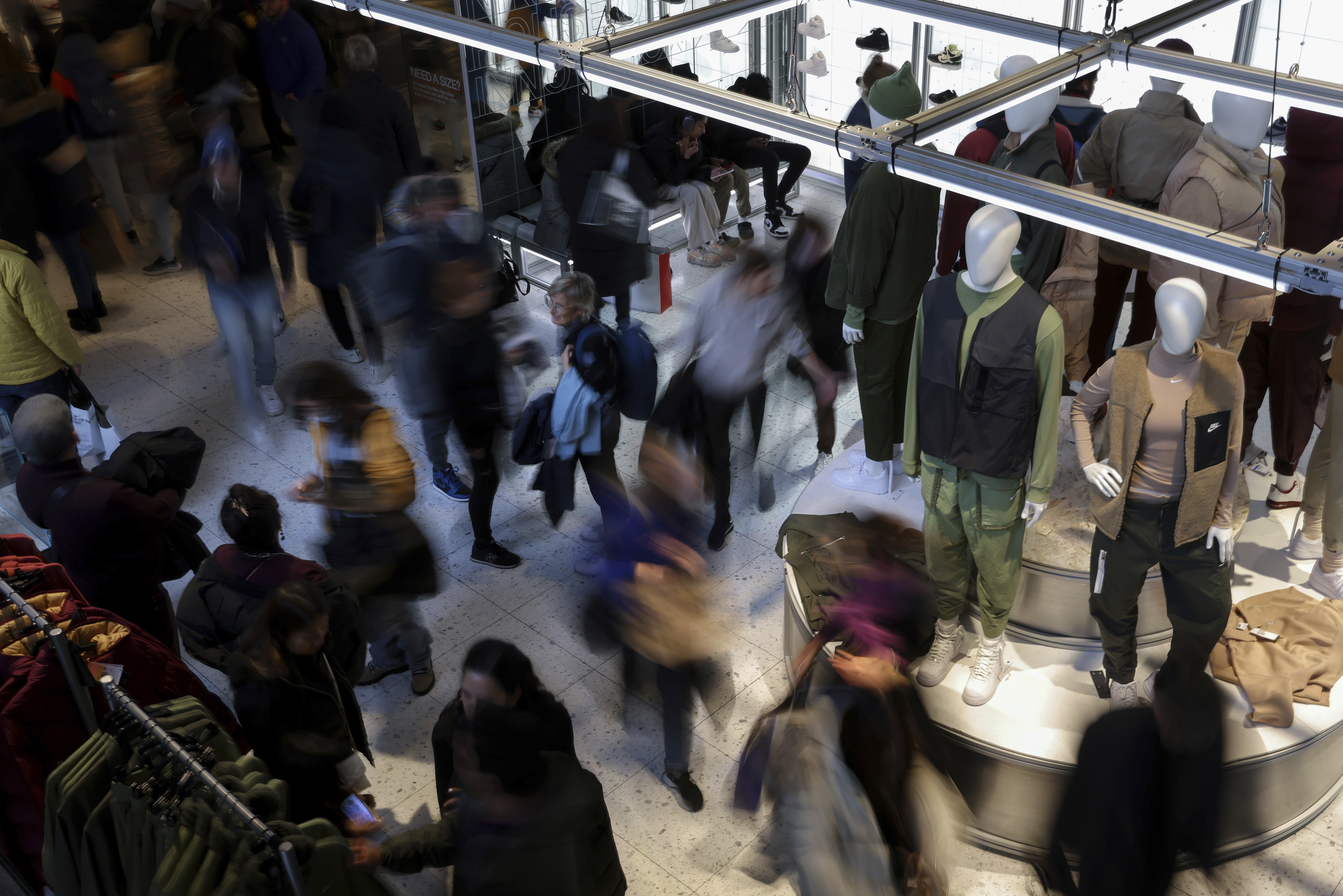 FILE - People shop at a retail store on Black Friday, Nov. 25, 2022, in New York. (AP Photo/Julia Nikhinson, File)