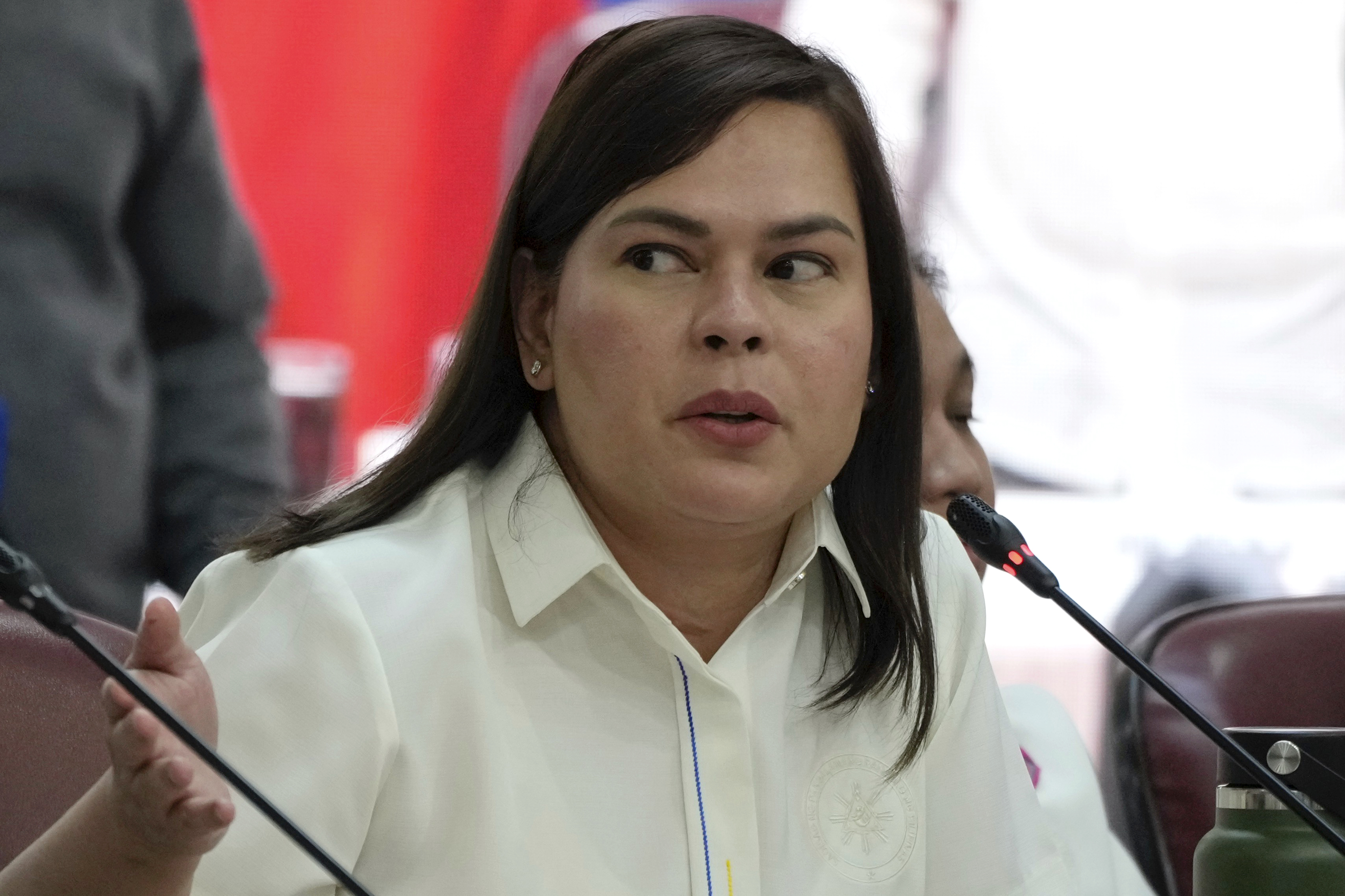 Philippine Vice President Sara Duterte gestures as she attends a hearing at the House of Representative in Quezon City, Philippines on Monday Nov. 25, 2024. (AP Photo/Aaron Favila)