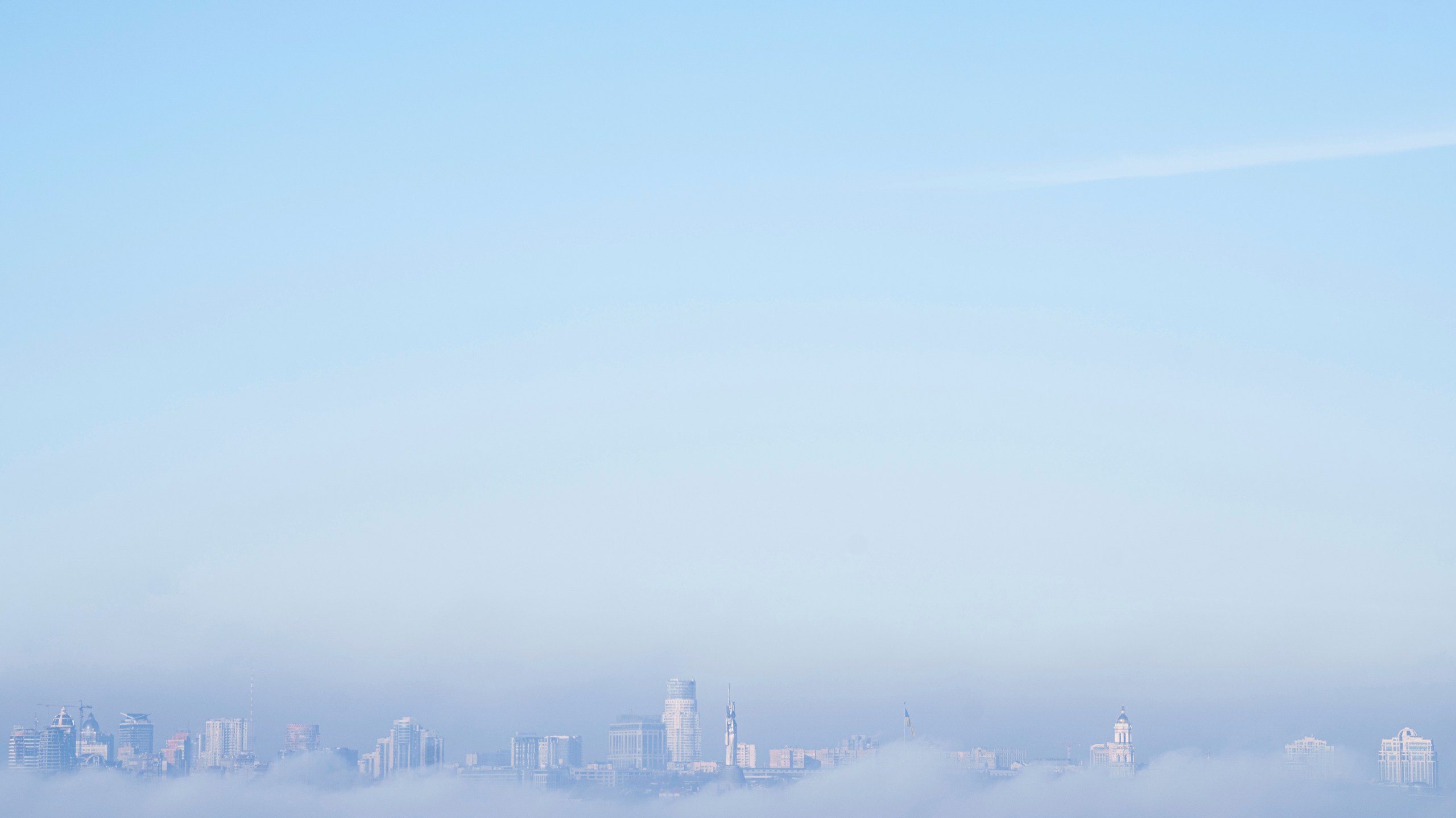 The Motherland Monument, center, and the thousand-year-old Monastery of Caves, also known as Kyiv Pechersk Lavra, the holiest site of Eastern Orthodox Christians are seen through the morning fog in Kyiv, Ukraine Monday, Nov. 25, 2024. (AP Photo/Evgeniy Maloletka)