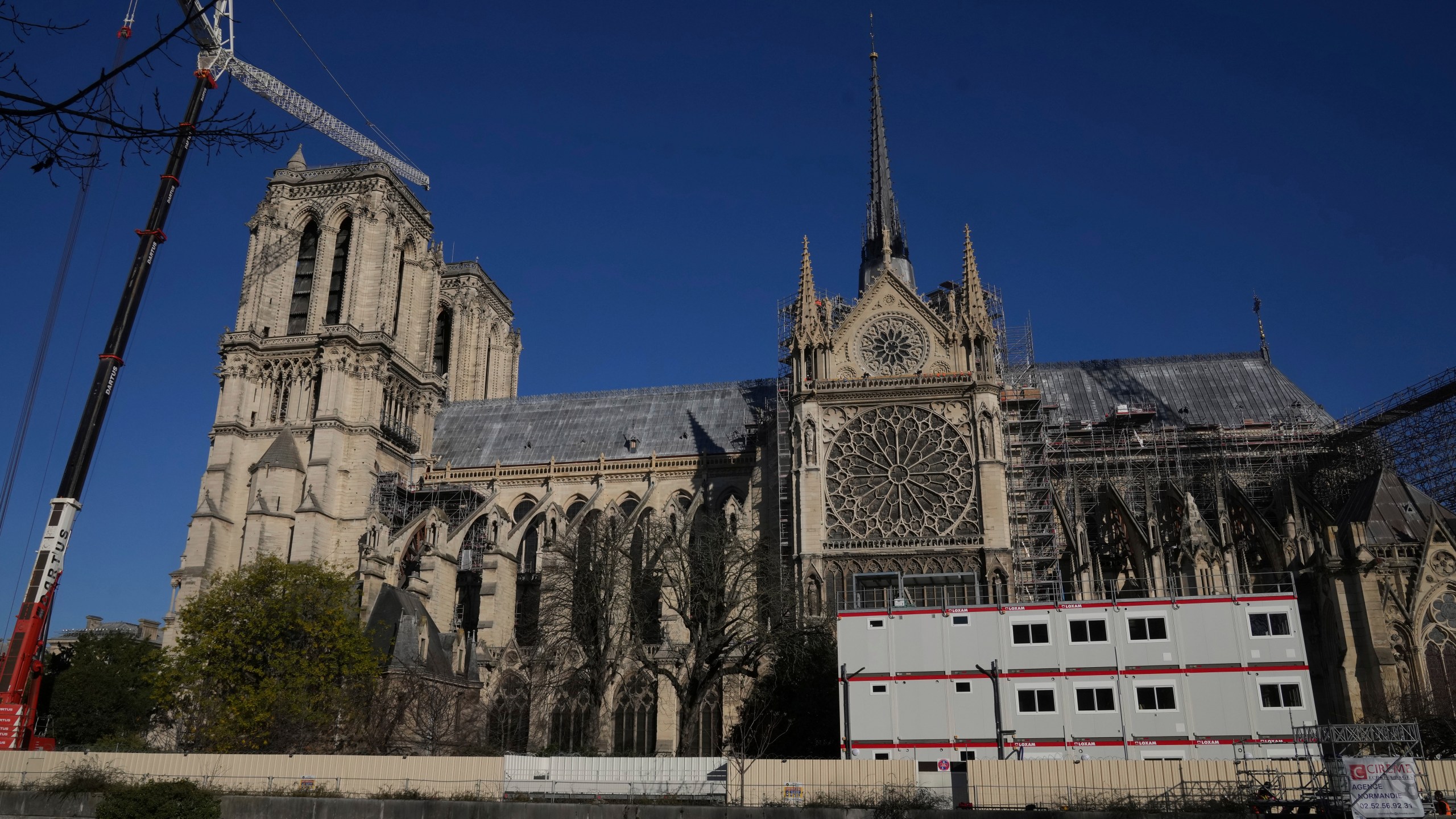 Cranes and workers' facilities are seen along Notre-Dame cathedral, Thursday, Nov. 28, 2024 in Paris. (AP Photo/Michel Euler)