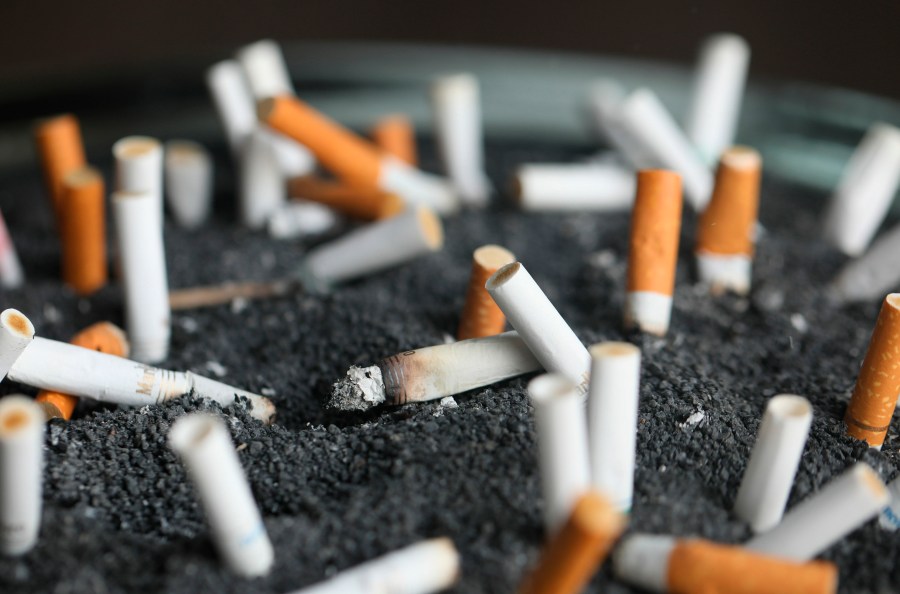 FILE - Cigarette butts sit in an ashtray on March 28, 2019, in New York. (AP Photo/Jenny Kane, File)