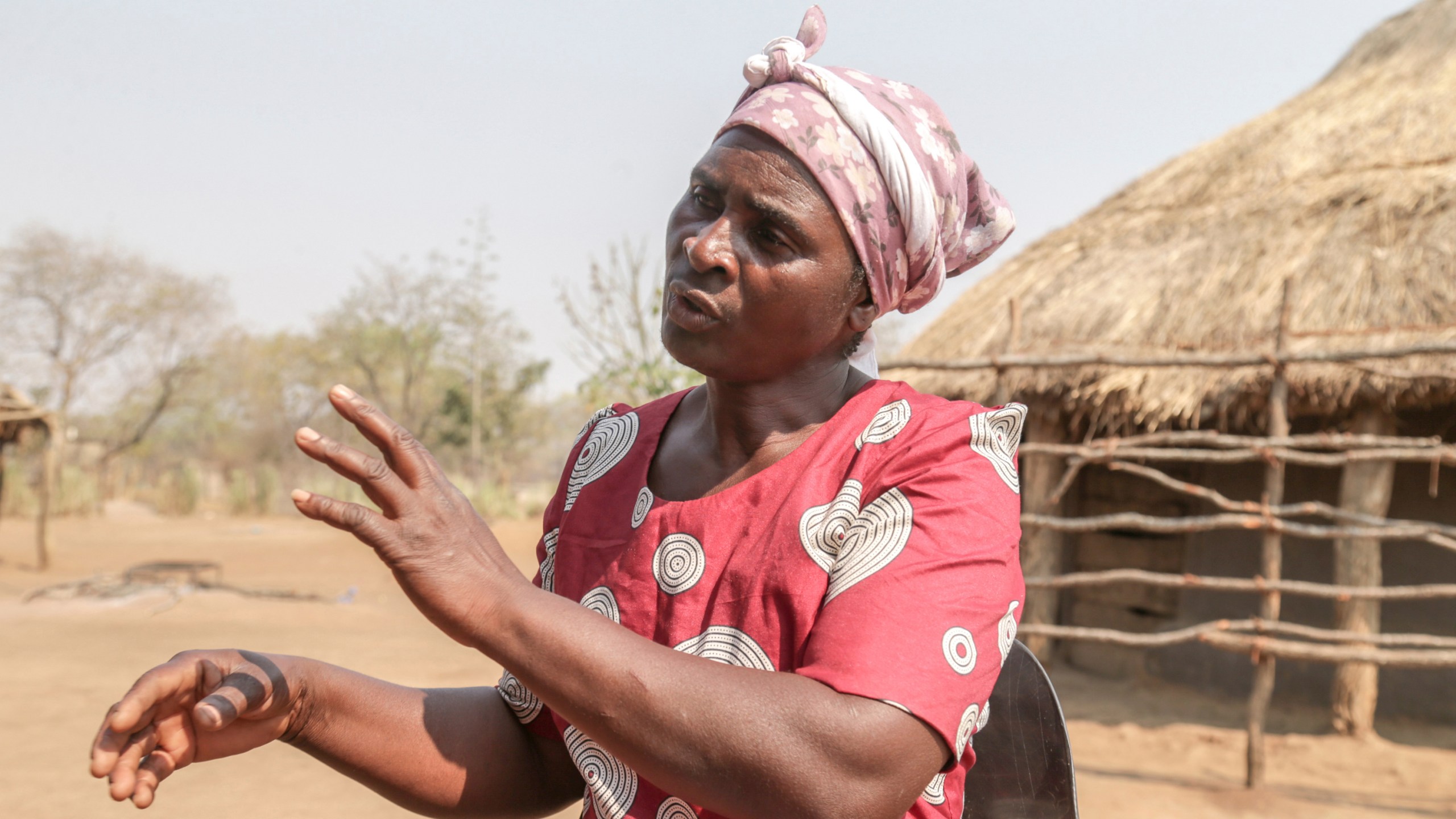 Maggot breeder, Chemari Choumumba works at a production tank of maggots at her home in Chiredzi, Zimbabwe Wednesday, Sept. 18, 2024. (AP Photo/Aaron Ufumeli)