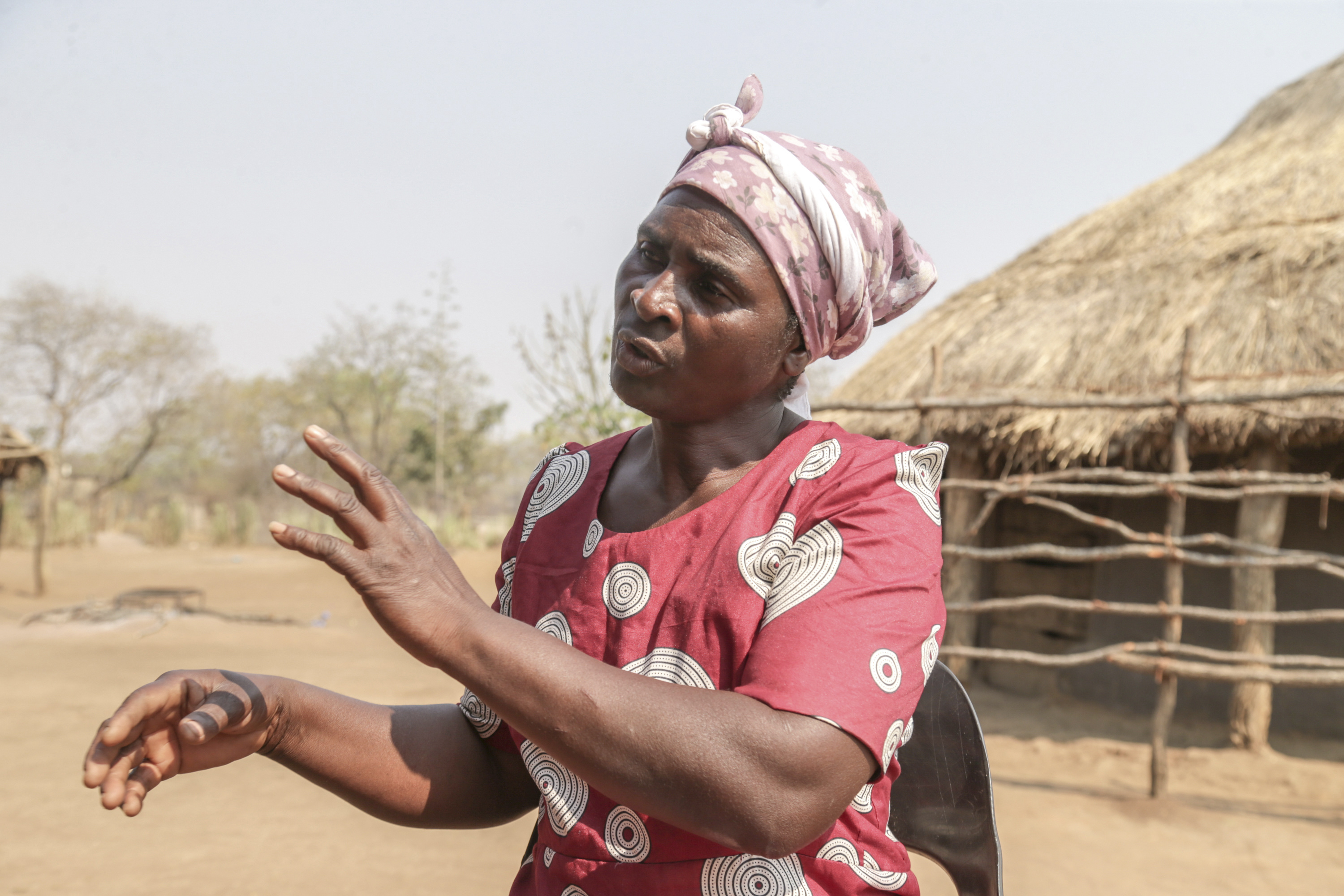 Maggot breeder, Chemari Choumumba works at a production tank of maggots at her home in Chiredzi, Zimbabwe Wednesday, Sept. 18, 2024. (AP Photo/Aaron Ufumeli)