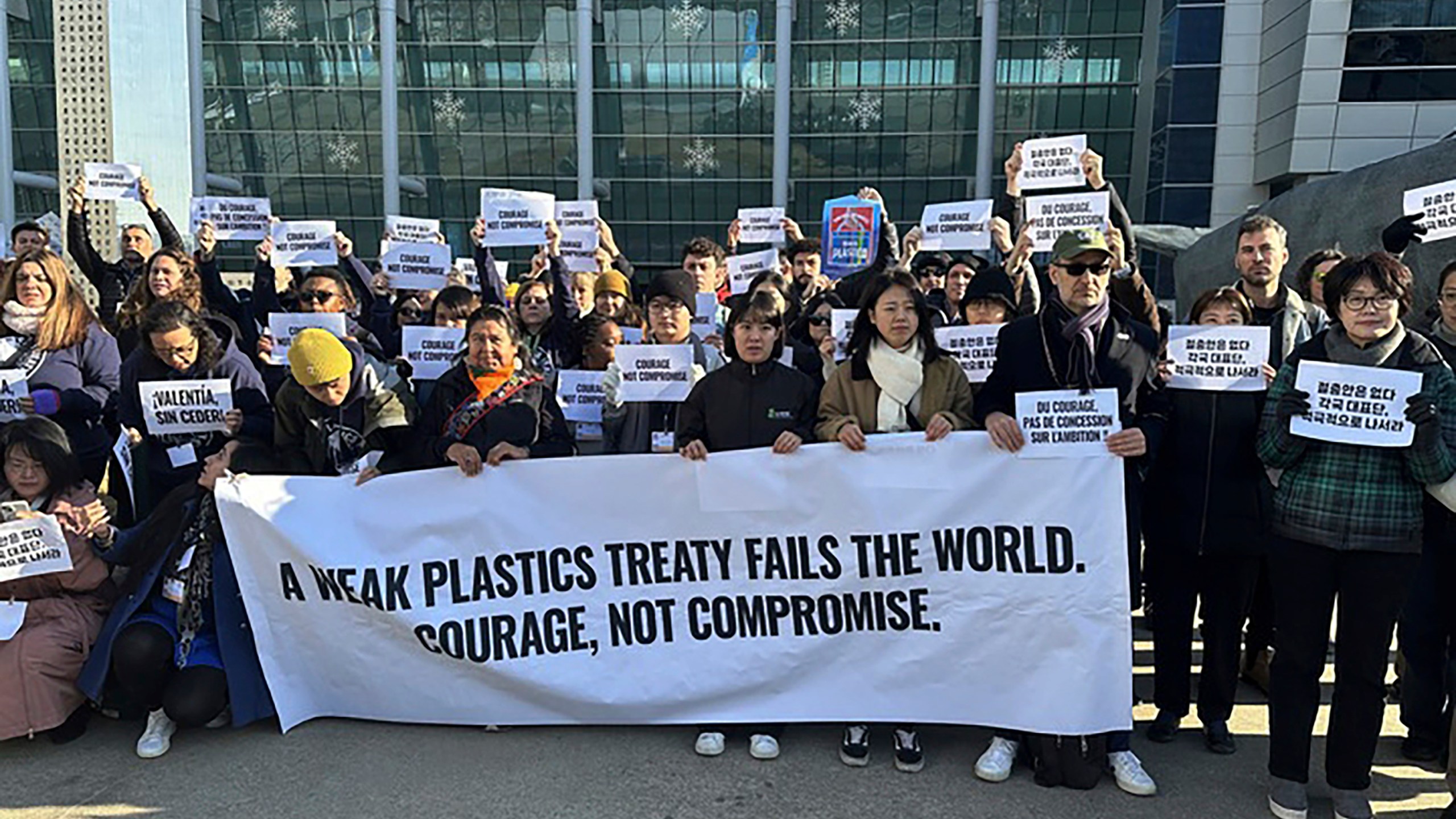 Environment activists hold a press conference calling for a strong global plastics treaty outside of the venue for the fifth session of the Intergovernmental Negotiating Committee on Plastic Pollution in Busan, South Korea, Friday, Nov. 29, 2024. (AP Photo/Jennifer McDermott)