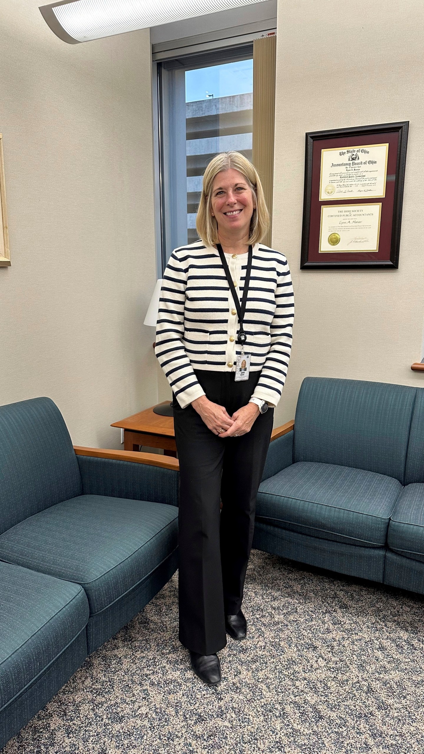 Acting Executive Director and Chief Financial Officer Lynn Hoover poses in her office at the headquarters of the State Teachers Retirement System in Columbus, Ohio, on Friday, Nov. 22, 2024. (AP Photo/Julie Carr Smyth)