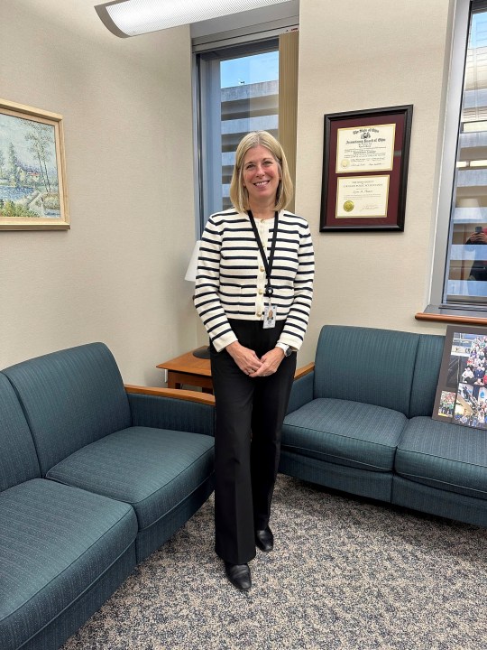 Acting Executive Director and Chief Financial Officer Lynn Hoover poses in her office at the headquarters of the State Teachers Retirement System in Columbus, Ohio, on Friday, Nov. 22, 2024. (AP Photo/Julie Carr Smyth)