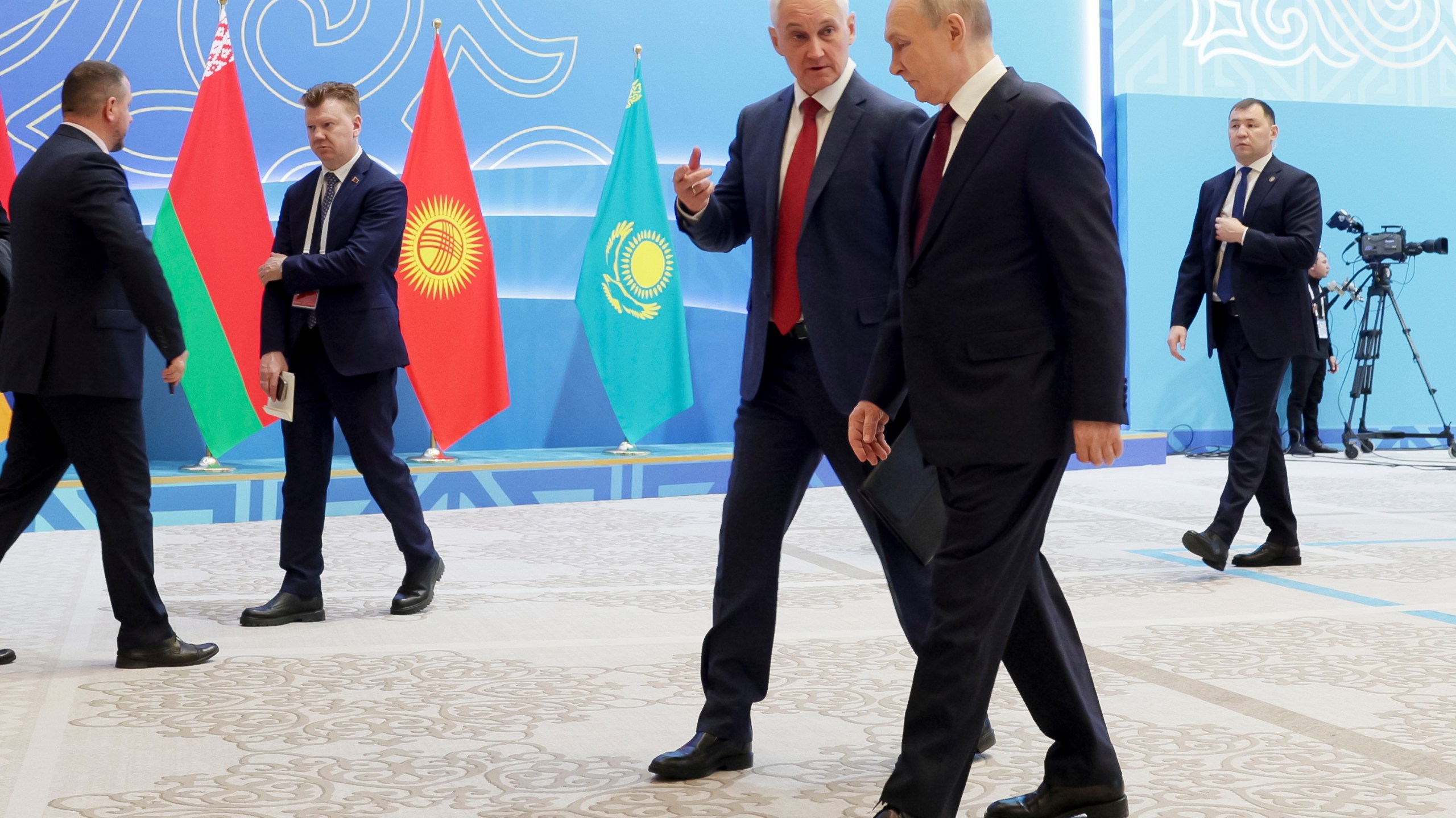 Russian President Vladimir Putin, right, listens to Russian Defense Minister Andrei Belousov as they walk on the sidelines of the summit of the Collective Security Treaty Organisation (CSTO) in Astana, Kazakhstan, Thursday, Nov. 28, 2024. (Gavriil Grigorov, Sputnik, Kremlin Pool Photo via AP)